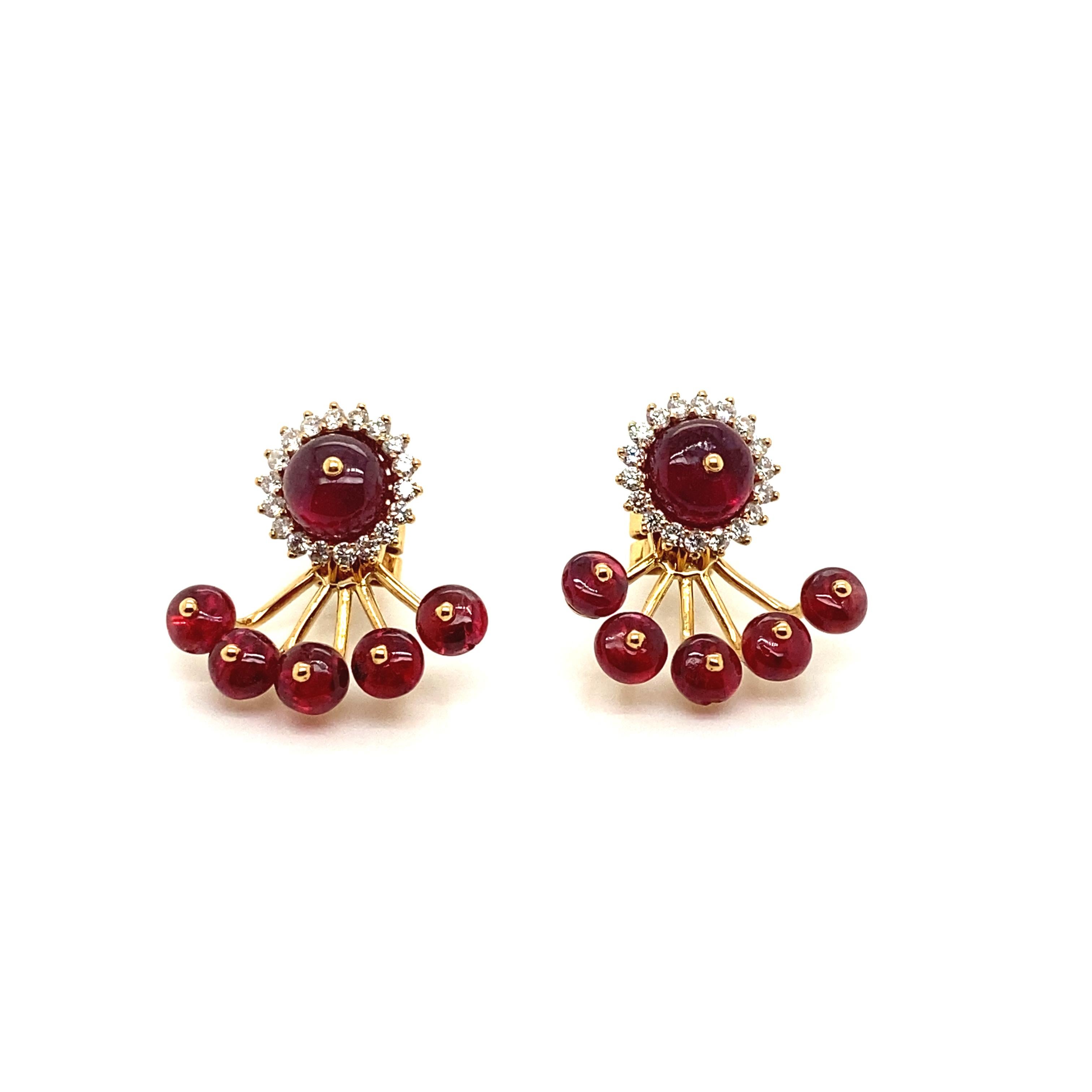 12.98 Carat Natural Red Spinel Beads and White Diamond Gold Earrings:

A playful pair of earrings, it features natural intense red spinel beads weighing 12.98 carat, with the tops surrounded by white round brilliant-cut diamonds weighing 0.68 carat.