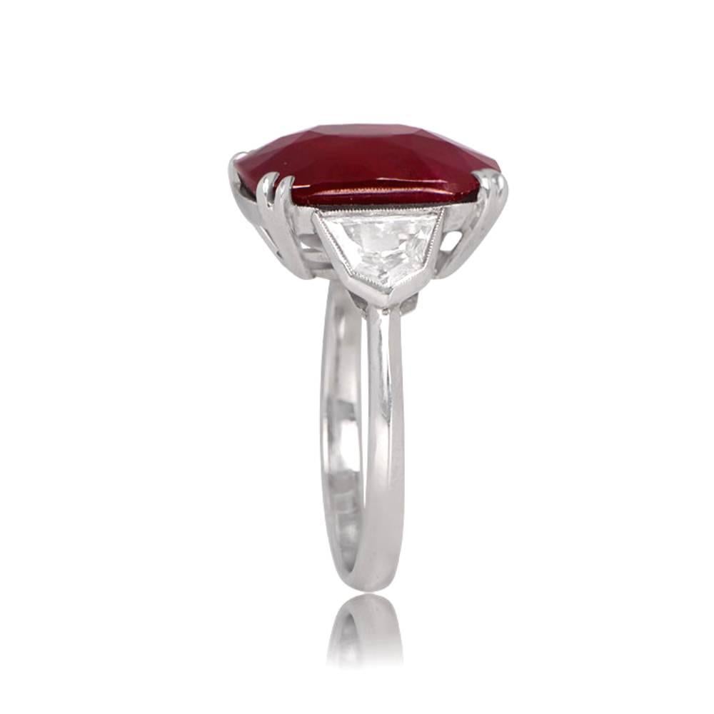 Indulge in pure luxury with a platinum hand-crafted ring featuring a 12.98 carat rare natural cushion-cut Burmese ruby certified by AGL, accented with shield-cut diamonds. The rarity of Burmese rubies with such size and quality make this an