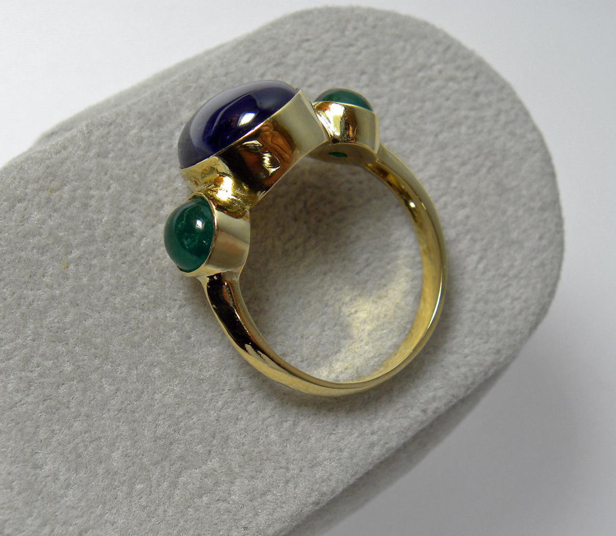 12.99 Carat Natural Untreated Sapphire & Emerald Three Stone Cocktail Ring 18k Yellow Gold
Composition: Solid  Rich Yellow Gold 18K
Primary Stone:100% Natural Sapphire Cabochon
Sapphire Weight: 10.99 Carats (1 gem) 
Treatment : None
Average Color