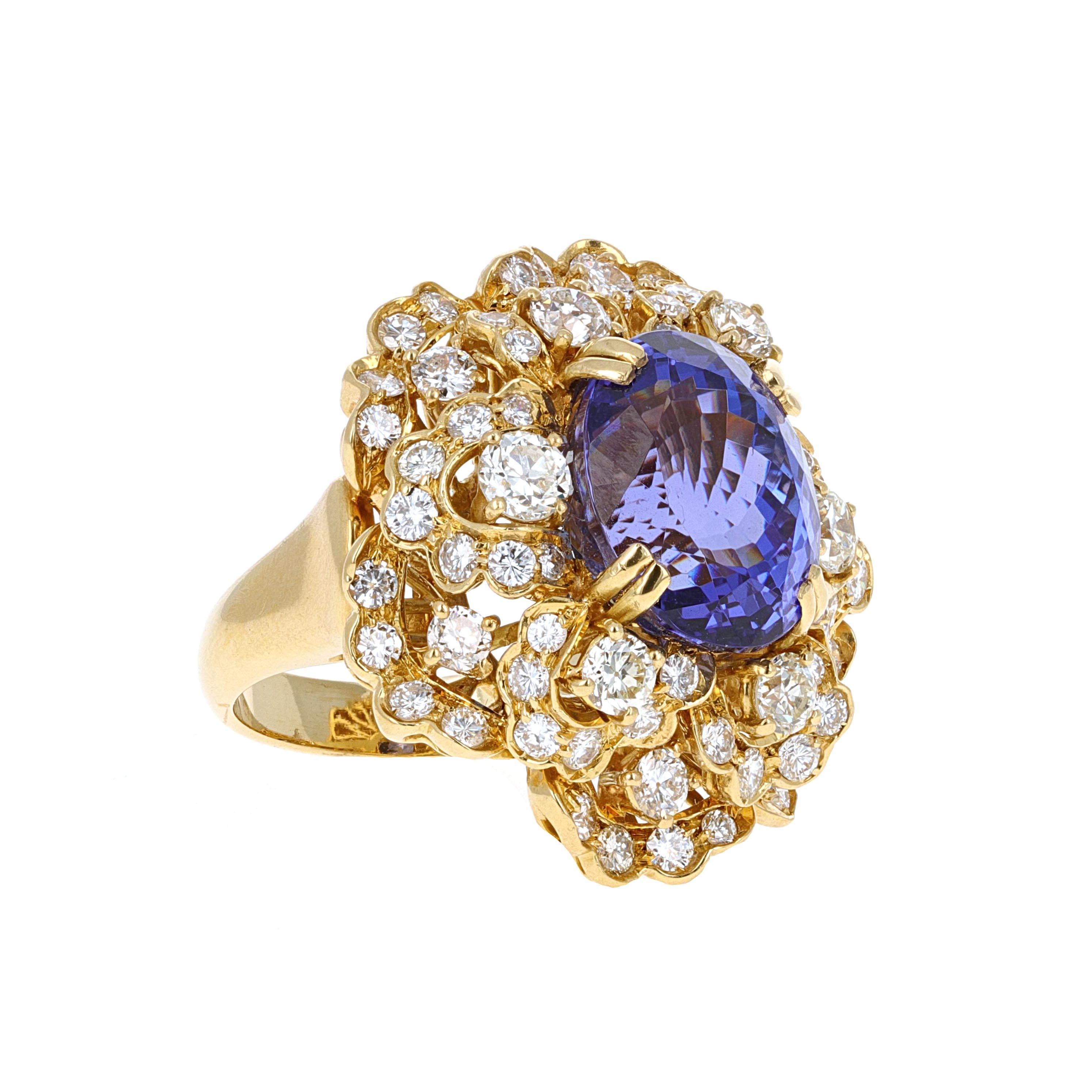 18 karat  yellow gold 12.99 carat Tanzanite and Diamond cocktail ring. The tanzanite is oval shape and a beautiful purplish blue color. The mounting has 72 diamonds weighing an estimated 3.50 carats total weight.
