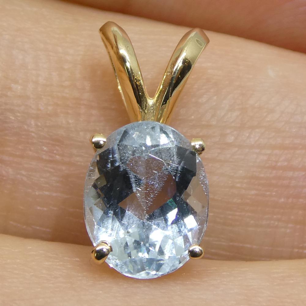 1.29ct Oval Blue Aquamarine Pendant set in 14k Yellow Gold For Sale 1