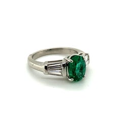 1.29 Carat Oval Emerald and Graduated Baguette Diamond Ring