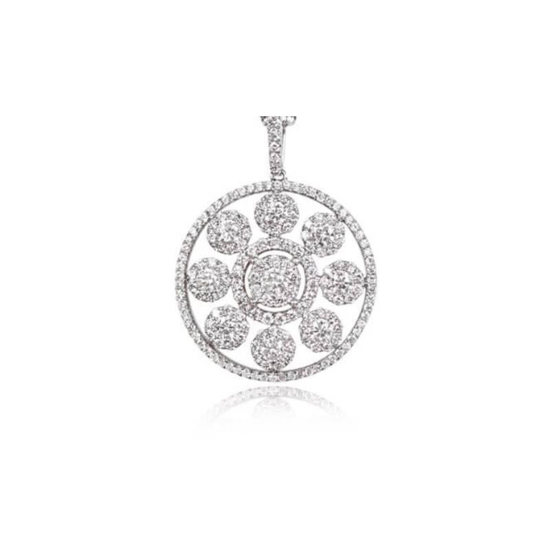 Embrace the enchanting allure of winter with this stunning snowflake motif pendant. Crafted in 18k white gold, it is adorned with a radiant collection of 1.29 carats of round brilliant cut diamonds. The mesmerizing centerpiece is encircled by two