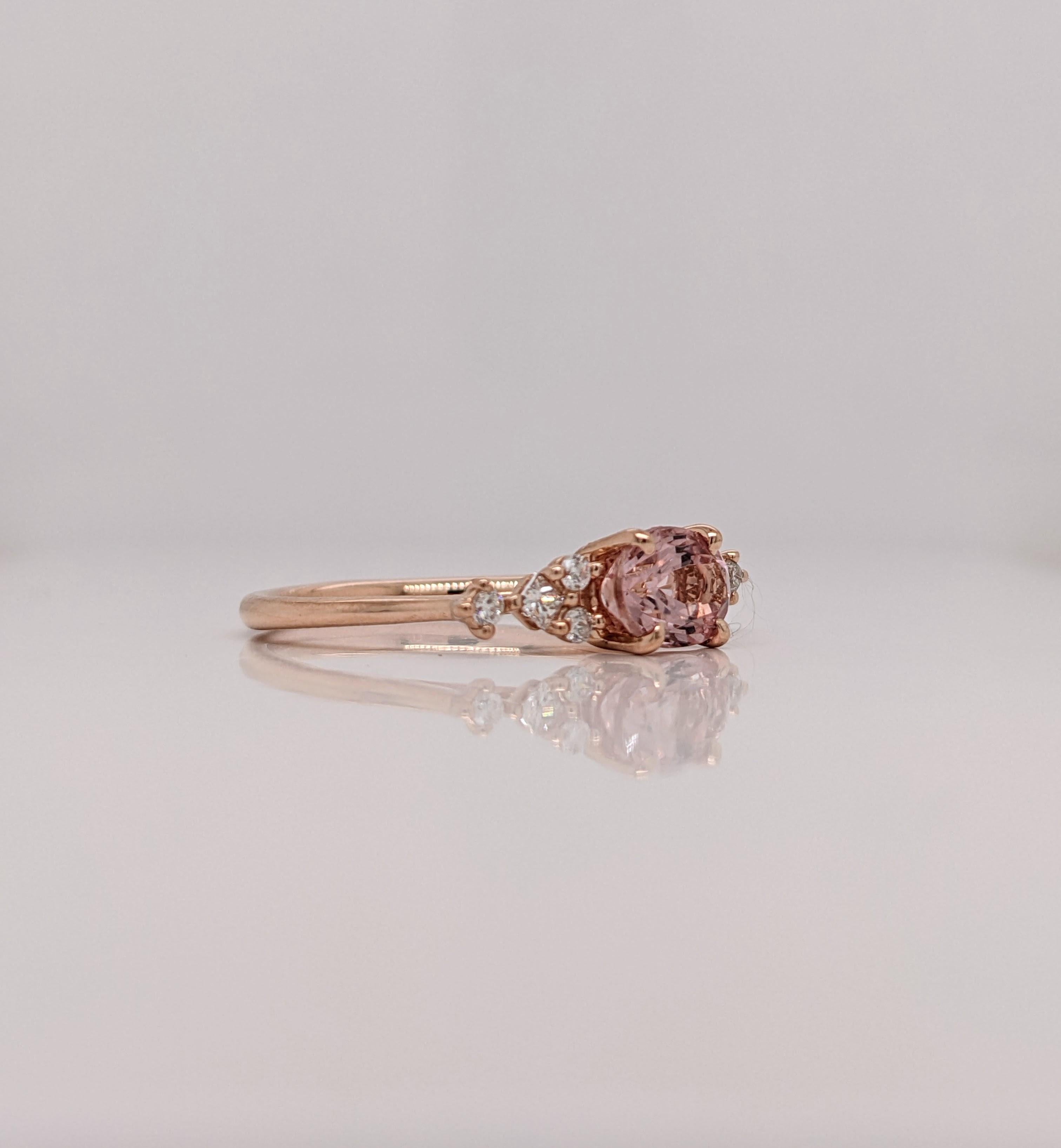 This dainty ring features a Cor De Rosa pink Morganite in 14k rose Gold with natural diamond accents. A timeless ring design perfect for an eye catching engagement or anniversary. This ring also makes a beautiful birthstone ring for your loved