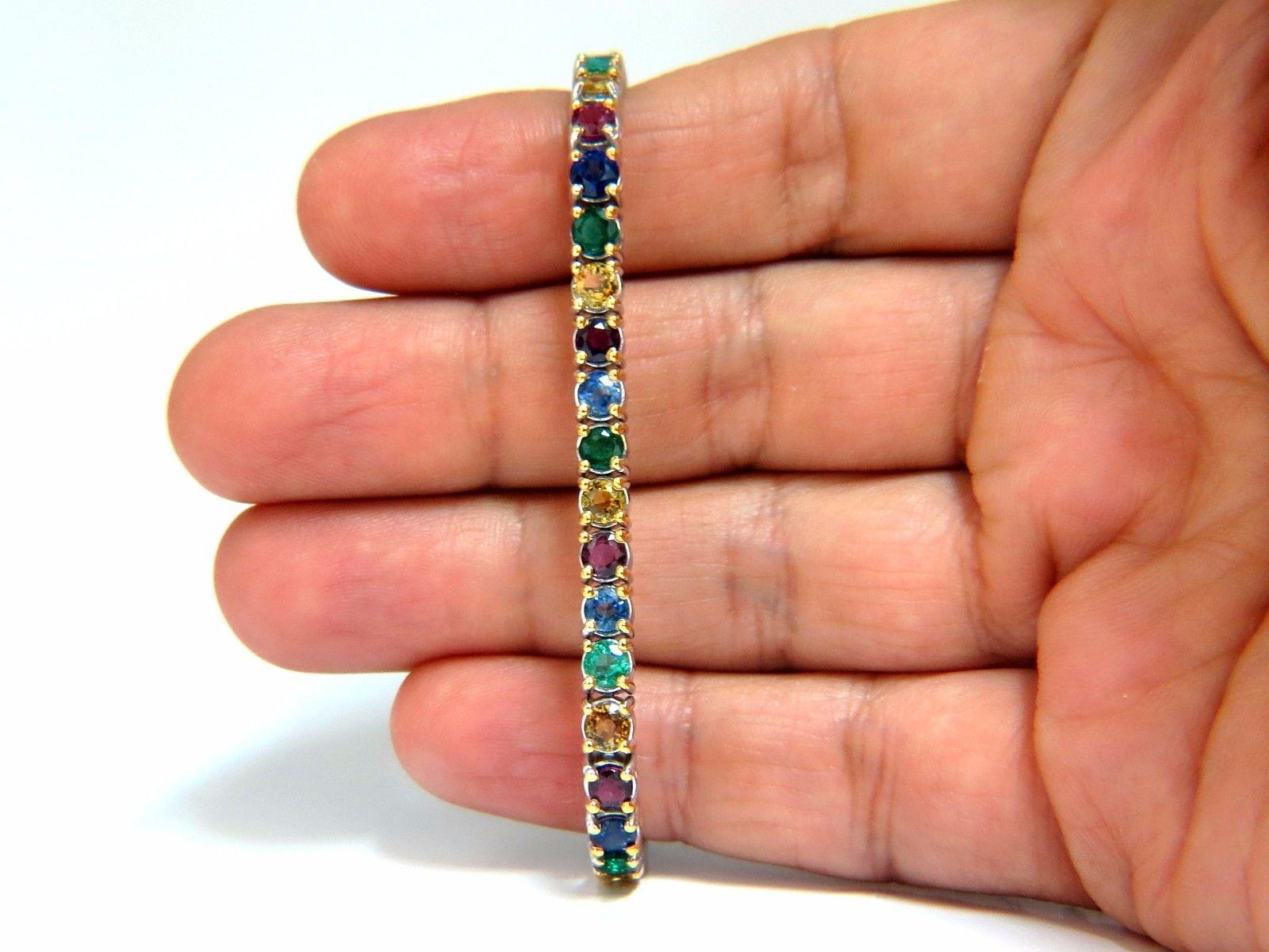 Gem Line.

12.00ct. Natural Sapphires, Ruby, & Emeralds bracelet.

Full round cuts, great sparkle.

Multicolor sapphires.

Vibrant Greens, Orange, Reds, yellows, Blues & Purple

Clean Clarity & Transparent.

Secure pressure clasp and safety
