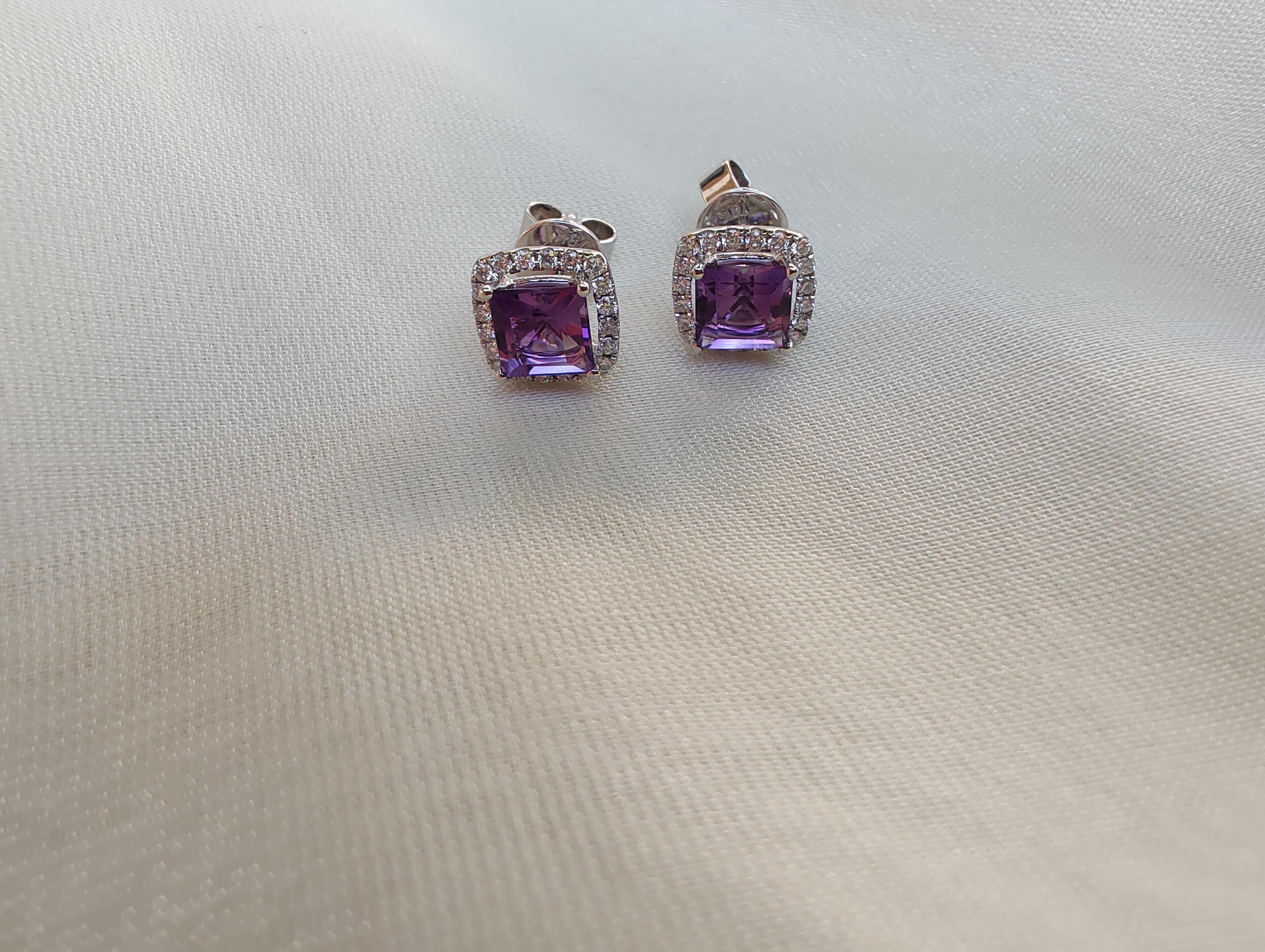 These beautifully crafted stud earrings showcase a halo of micro -pave round brilliant cut collection quality diamonds that elegantly frame the centre princess cut fine Amethyst stone. 
A classic and elegant design suitable for any occasion. 
This