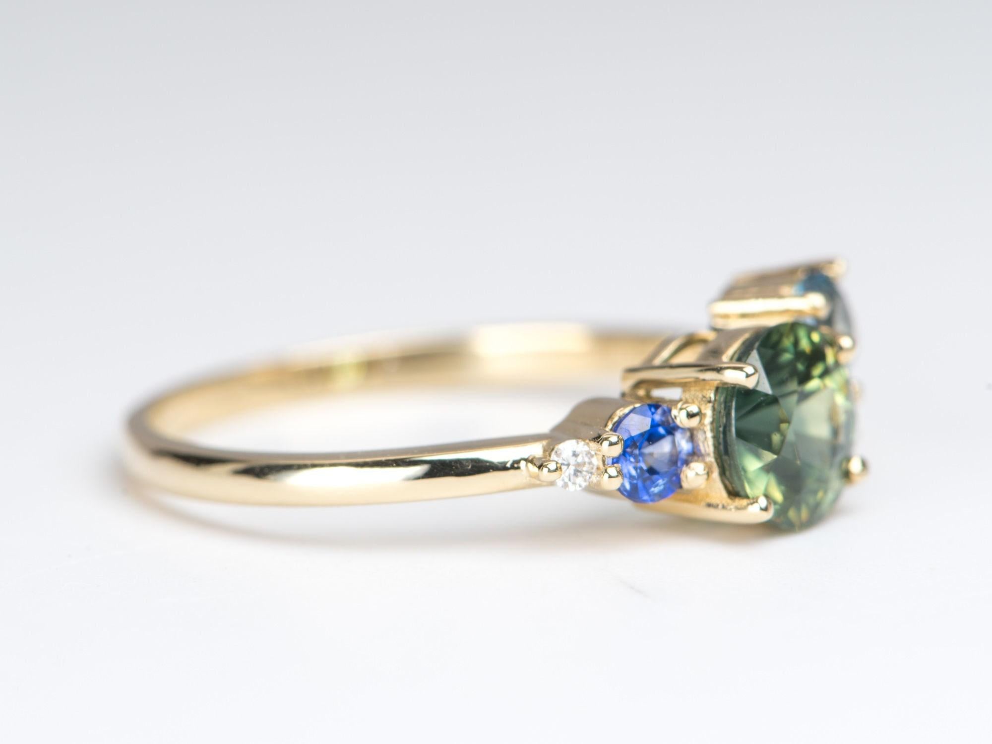 ♥ 1.2ct Teal Blue Sapphire Cluster Ring 14K Yellow Gold Diamond Topaz Tourmaline
♥ Solid 14k yellow gold ring set with a beautiful round-shaped sapphire
♥ Gorgeous blue green color!
♥ The item measures 6.6 mm in length, 15.6 mm in width, and stands