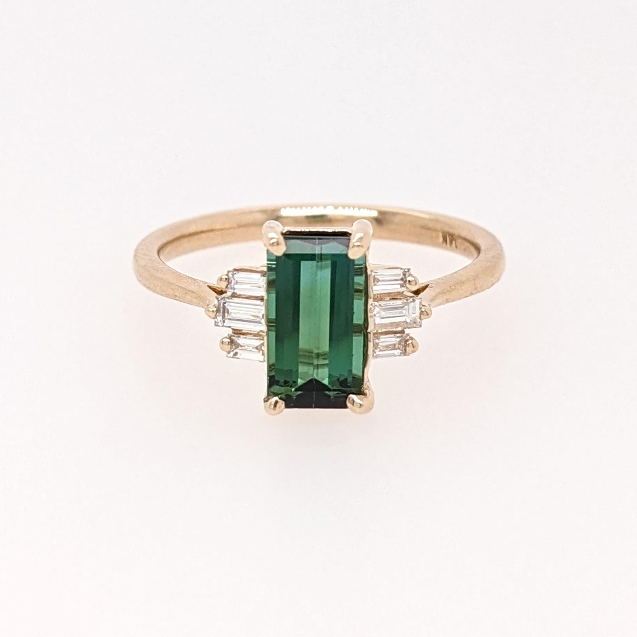 A vivid green Tourmaline looks exquisite in this elegant minimalist ring with cute diamond accents. A statement ring design perfect for an eye catching engagement or anniversary. This ring also makes a beautiful October birthstone ring for your