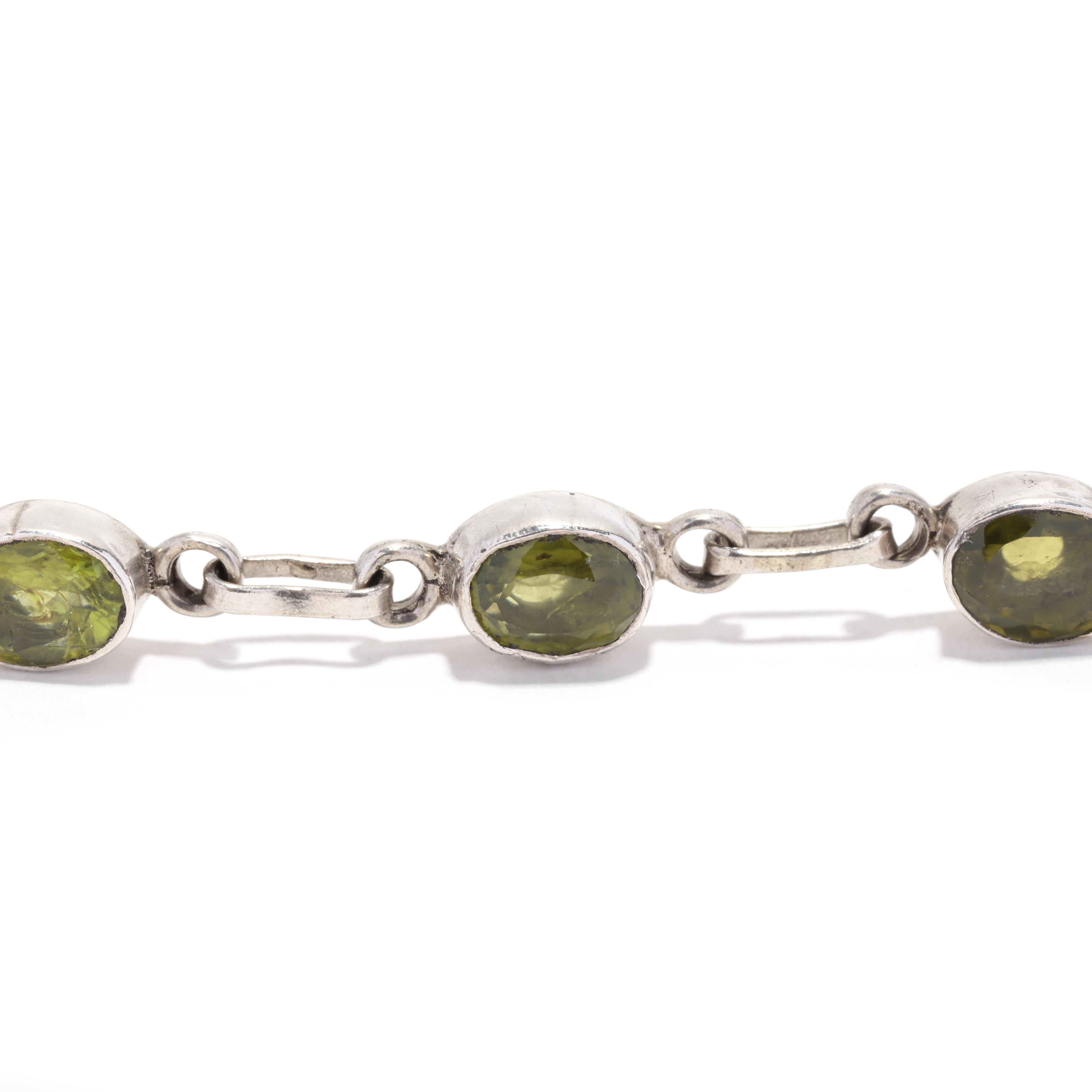This stunning August birthstone bracelet is perfect for the special lady in your life. Crafted from sterling silver and featuring 12ctw of bezel set peridot stones, this beautiful bracelet is 8.75 inches long and is sure to become a family heirloom.