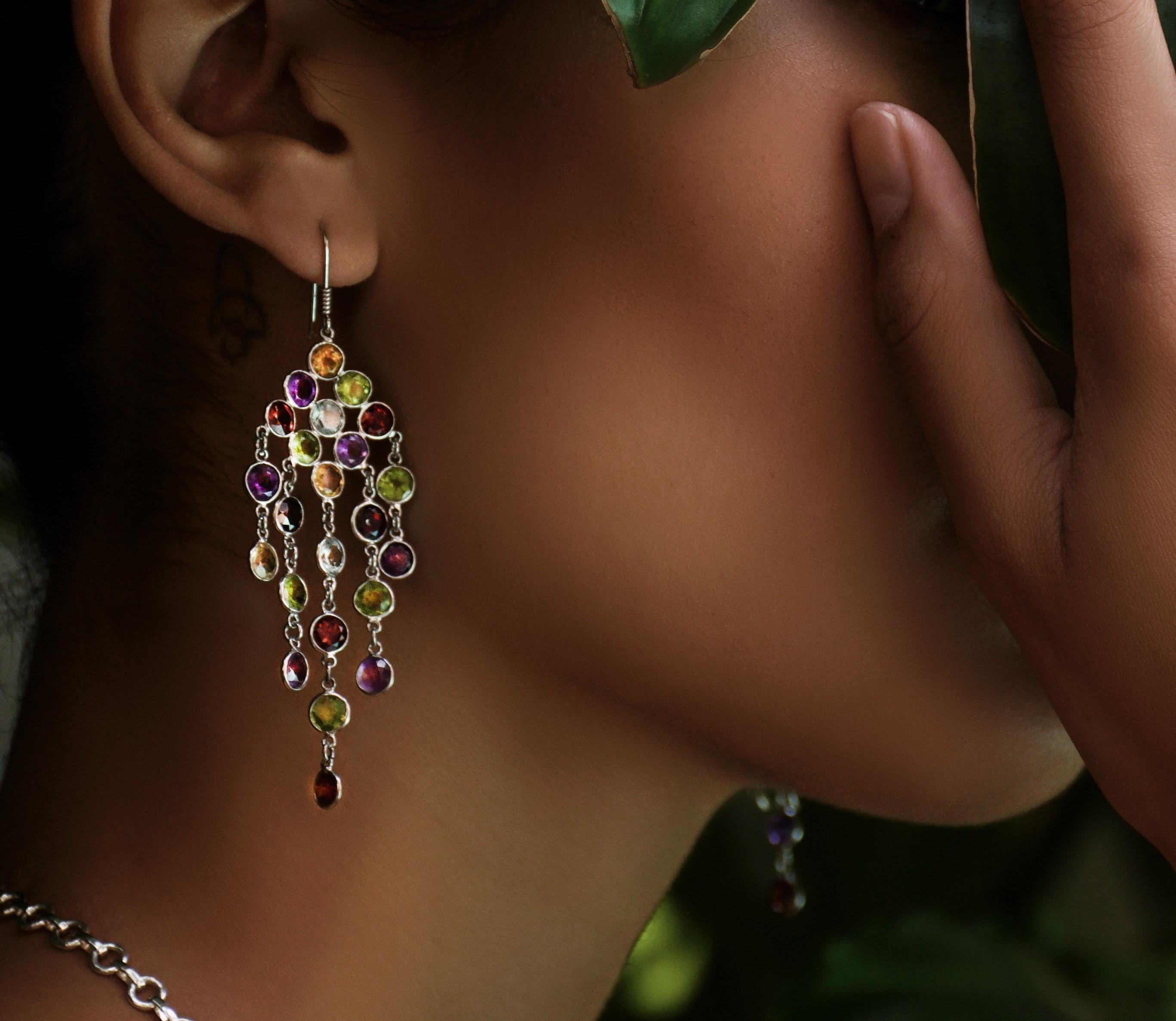 Imagine wearing this beautiful 11.5ctw Mix Gemstone Chandelier Earrings of platinum coated sterling silver, a dazzling showcase of nature's finest hues and captivating gemstones. These exquisite Pin Chandelier earrings feature a harmonious blend of