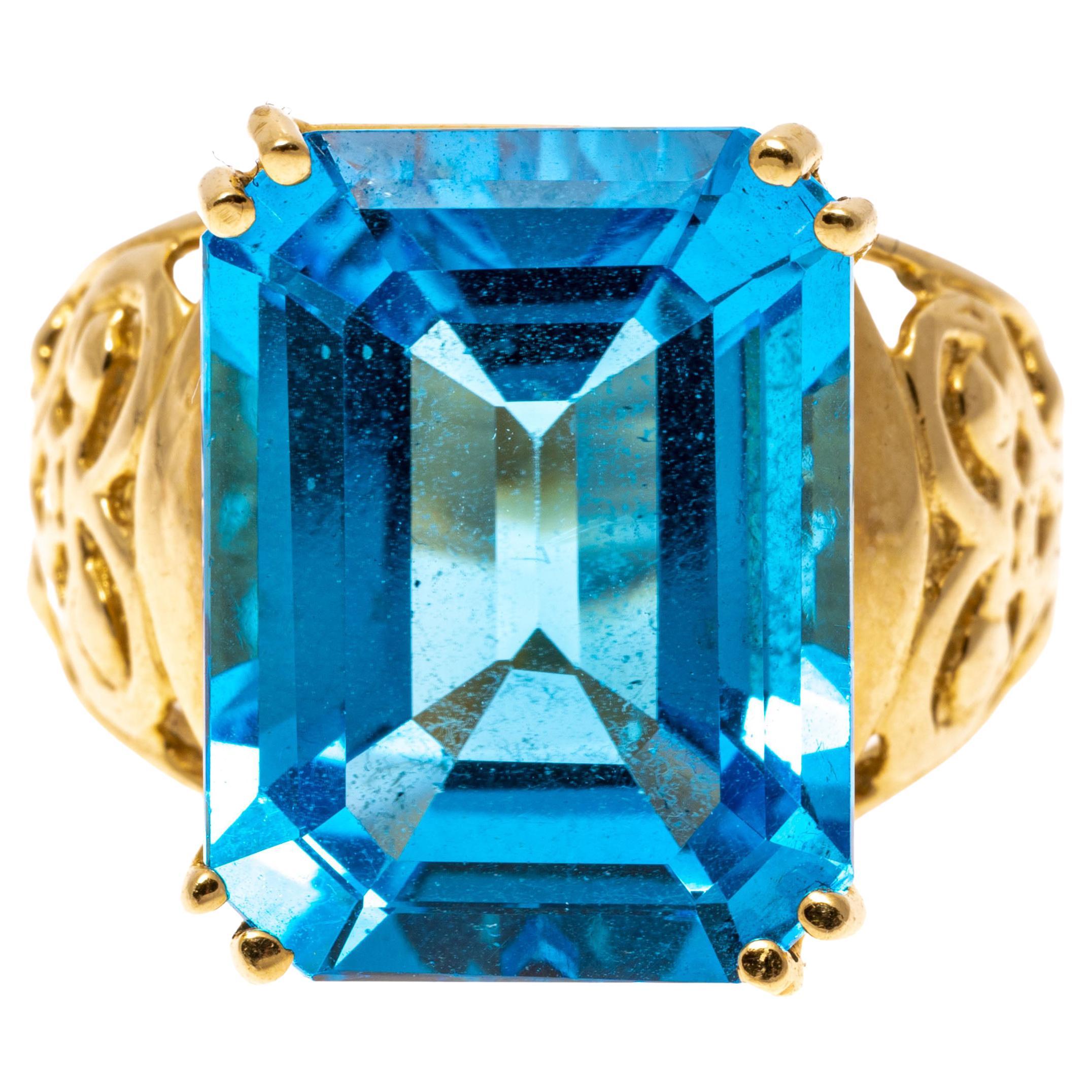 12k Gold Large Emerald Cut Deep Blue Color Blue Topaz Pierced Ring For Sale