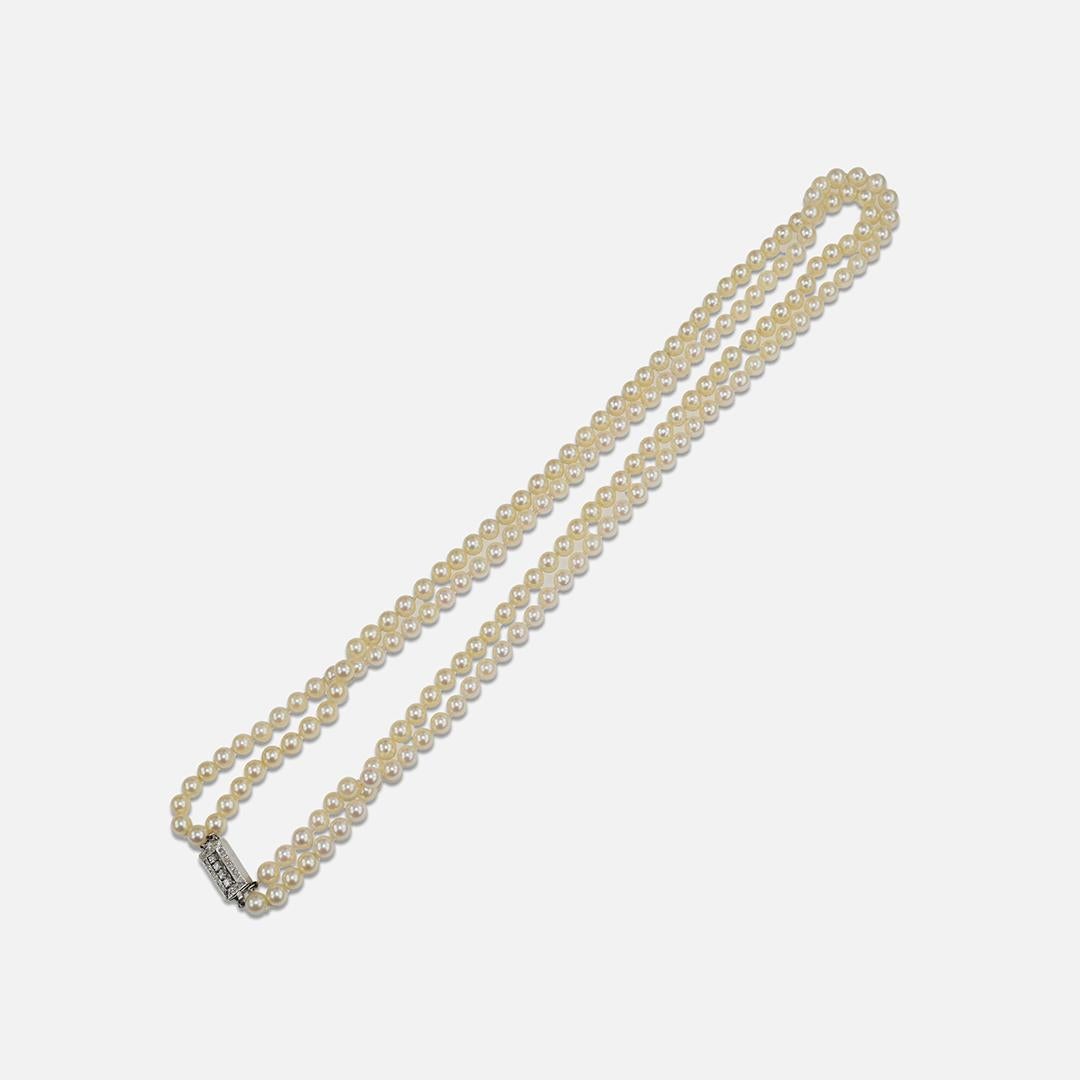 Round Cut 12K White Gold Vintage Double Strand Pearl Necklace with Diamond Clasp For Sale