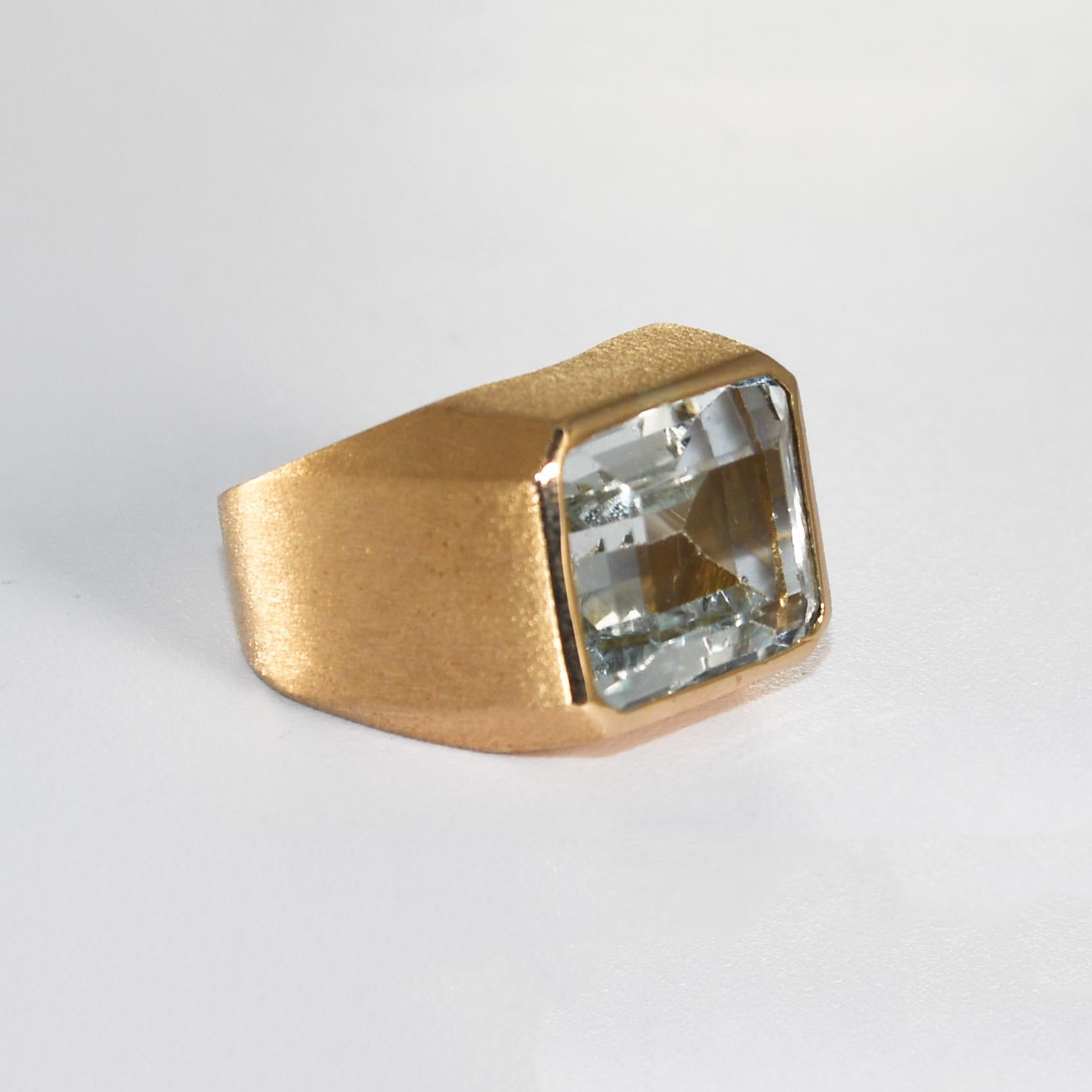 Ladies' vintage aquamarine ring in 12k yellow setting.
The gross ring weight is 14.2 grams ( contains 12.4 grams of 12k gold).
The setting tests 51% gold using an XRF metals analyzer.
The aquamarine is pale blue, rectangular, step cut, 9.00