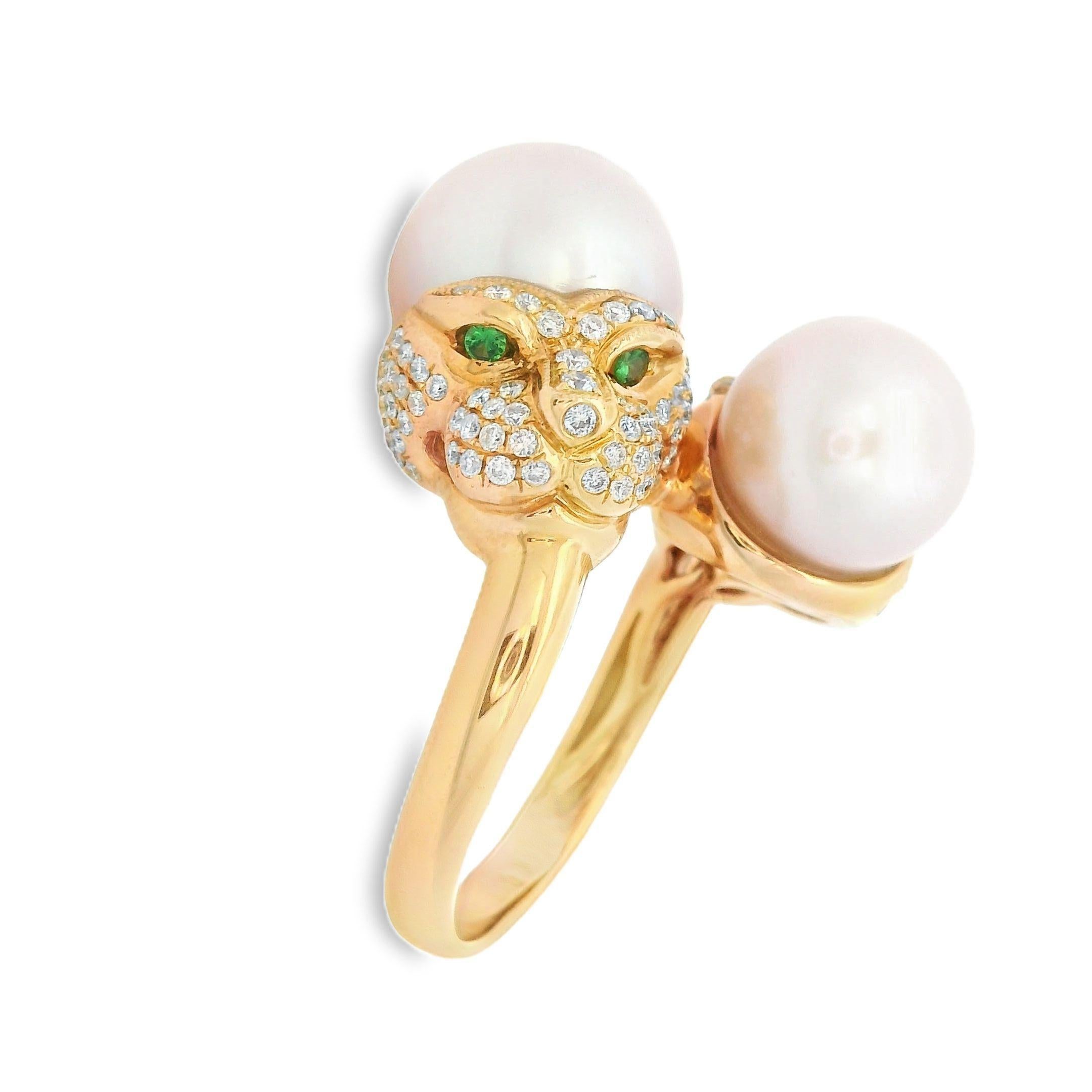 This stunning ring is an exquisite blend of elegance and sophistication, designed to make a bold statement. It features two beautiful freshwater pearls: an 11mm pearl and a 9mm pearl, both showcasing a lustrous sheen. Below one of the pearls, a