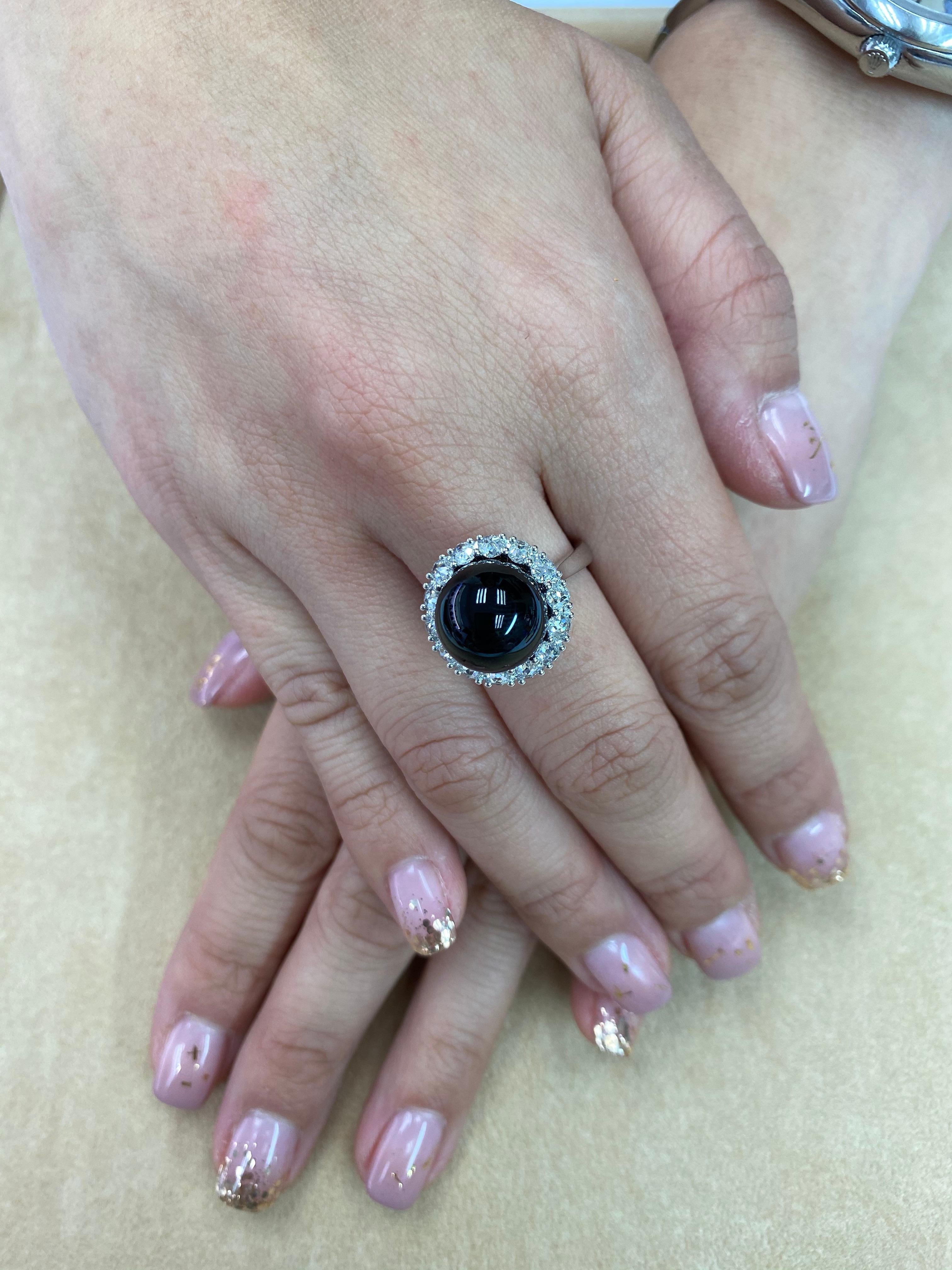 Please check out the HD video! Here is a beautiful Onyx and true antique rose cut diamond ring. The ring is set in 18k white gold. The Onyx is 12mm in size and round. There are 14 authentic antique rose cut diamonds totaling 0.75Cts making up a halo