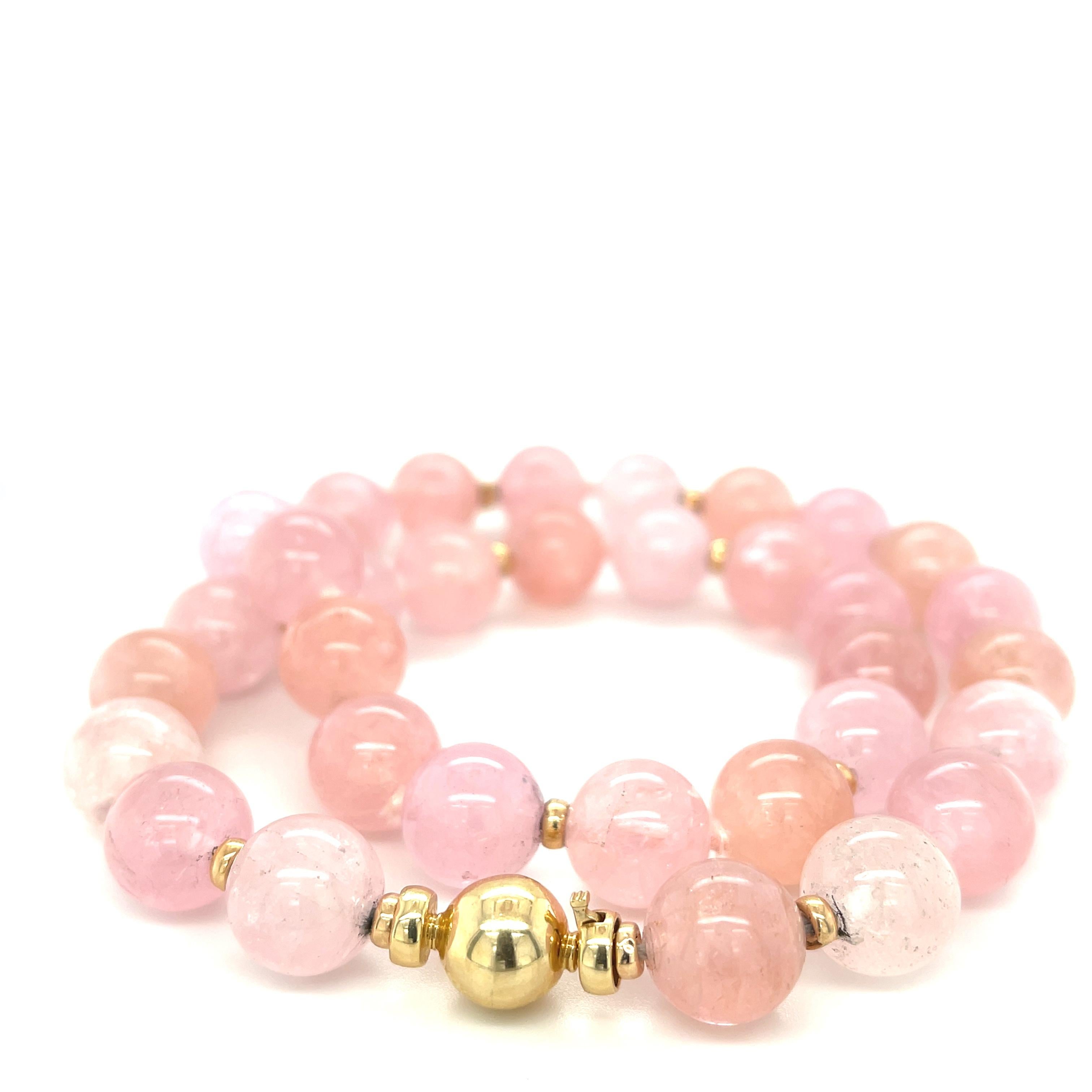 If you love shades of pink and peach, this morganite beaded necklace is perfect for you! Beautifully translucent 12mm round morganite beads have been hand strung on pink silk thread with 14k yellow gold accents finished with a 14k yellow gold ball