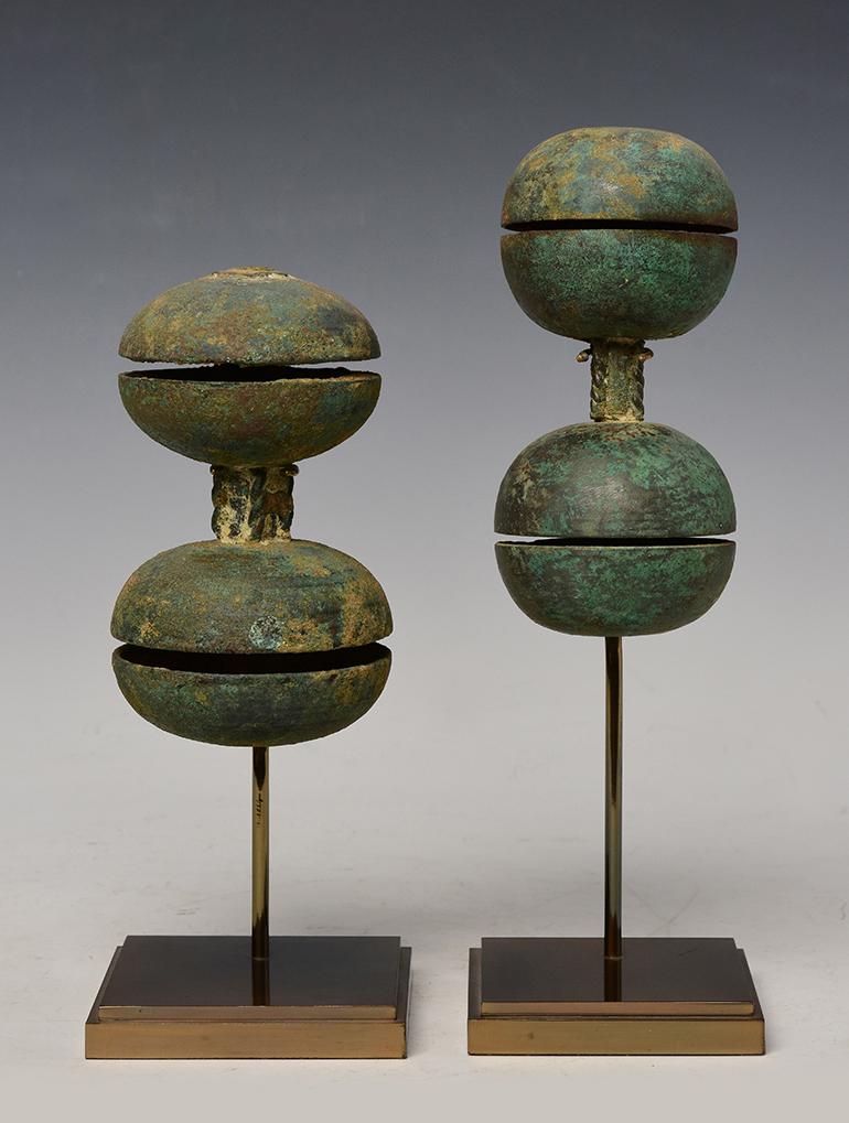 A pair of Khmer bronze hand bells with very nice patina.

Age: Cambodia, Angkor Vat Period, 12th Century
Size: Height 12.8 - 14 C.M. / Width 6.5 - 7.8 C.M.
Size including stand: Height 20.5 - 25 C.M.
Condition: Nice condition overall (some expected