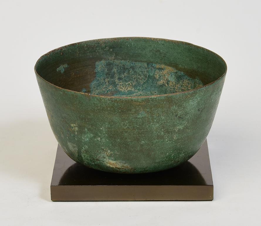 Khmer bronze bowl with nice green patina.

Age: Cambodia, Angkor Vat period, 12th Century
Size: height 7.1 cm. / width 19.3 cm.
Condition: Nice condition overall (some expected degradation due to its age).

100% Satisfaction and authenticity