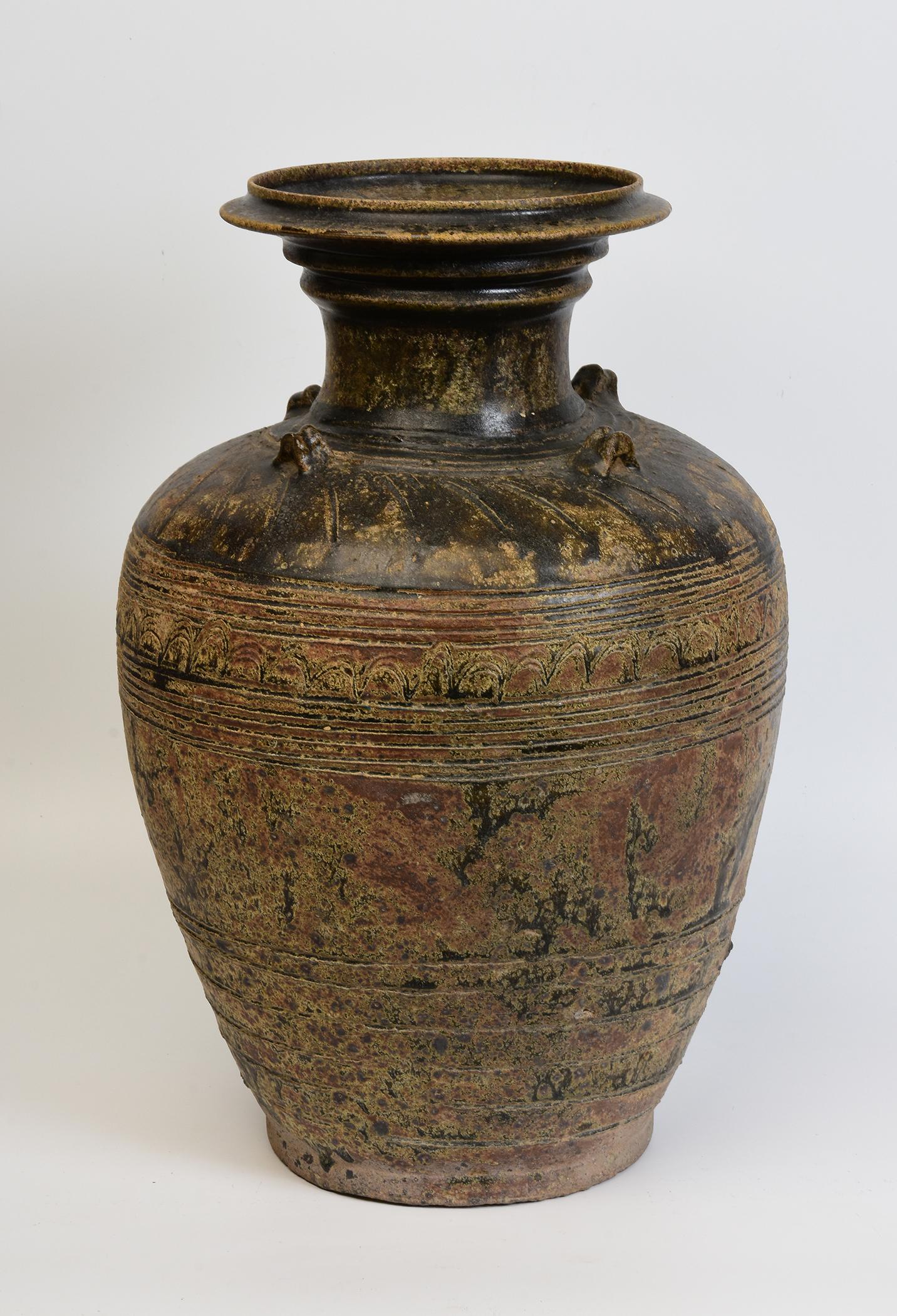 Antique Khmer dark-brown glazed pottery jar with flared mouth, decorated with carved band around the neck, encircled lines on the lower body and foot.

Age: Cambodia, Angkor Vat Period, 12th Century
Size: Height 47.5 C.M. / Width 30.5
