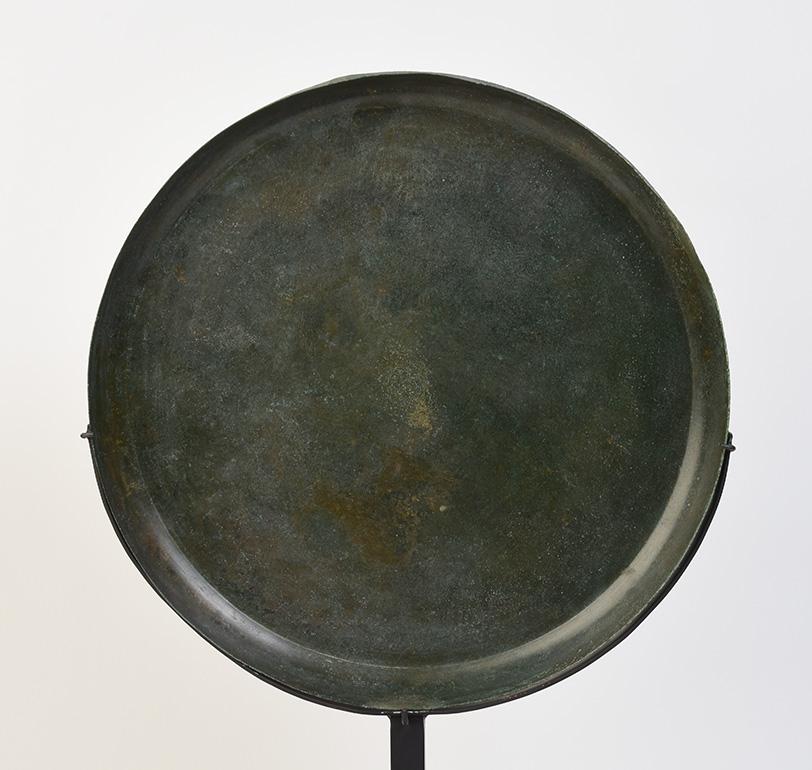 Khmer bronze tray in circular form with nice patina.

Age: Cambodia, Angkor Vat Period, 12th Century
Size: Diameter 34.5 C.M./ Thickness 3.4 C.M. / Height including stand 56.8 C.M.
Condition: Nice condition overall.

100% Satisfaction and