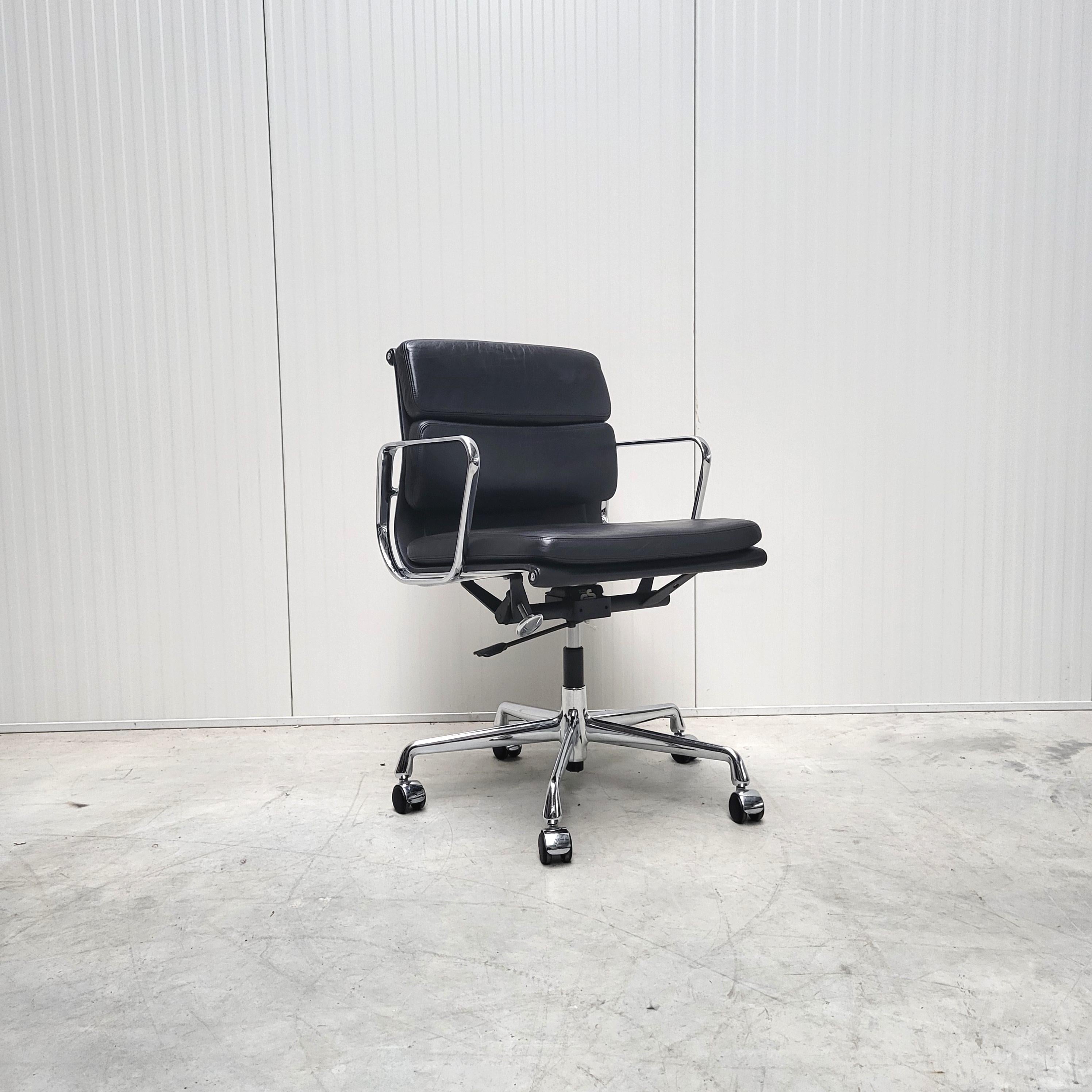 Rare opportunity to purchase a set of 12x Eames soft pad office chairs model EA217 produced by Vitra. 
The chairs features a chromed aluminium frame and a very soft black leather all of which are in a very good and clean condition. 

The chairs were