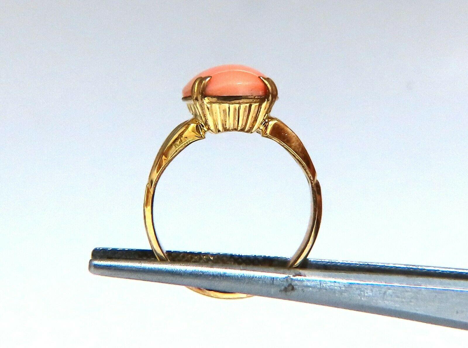 4ct. Vintage natural Coral ring.

Pink Coral measures 12x10 mm

Depth of ring 6.9 mm.

10 karat yellow gold 2.6 grams.

Current size 5 1/2 and we may resize, please inquire.
