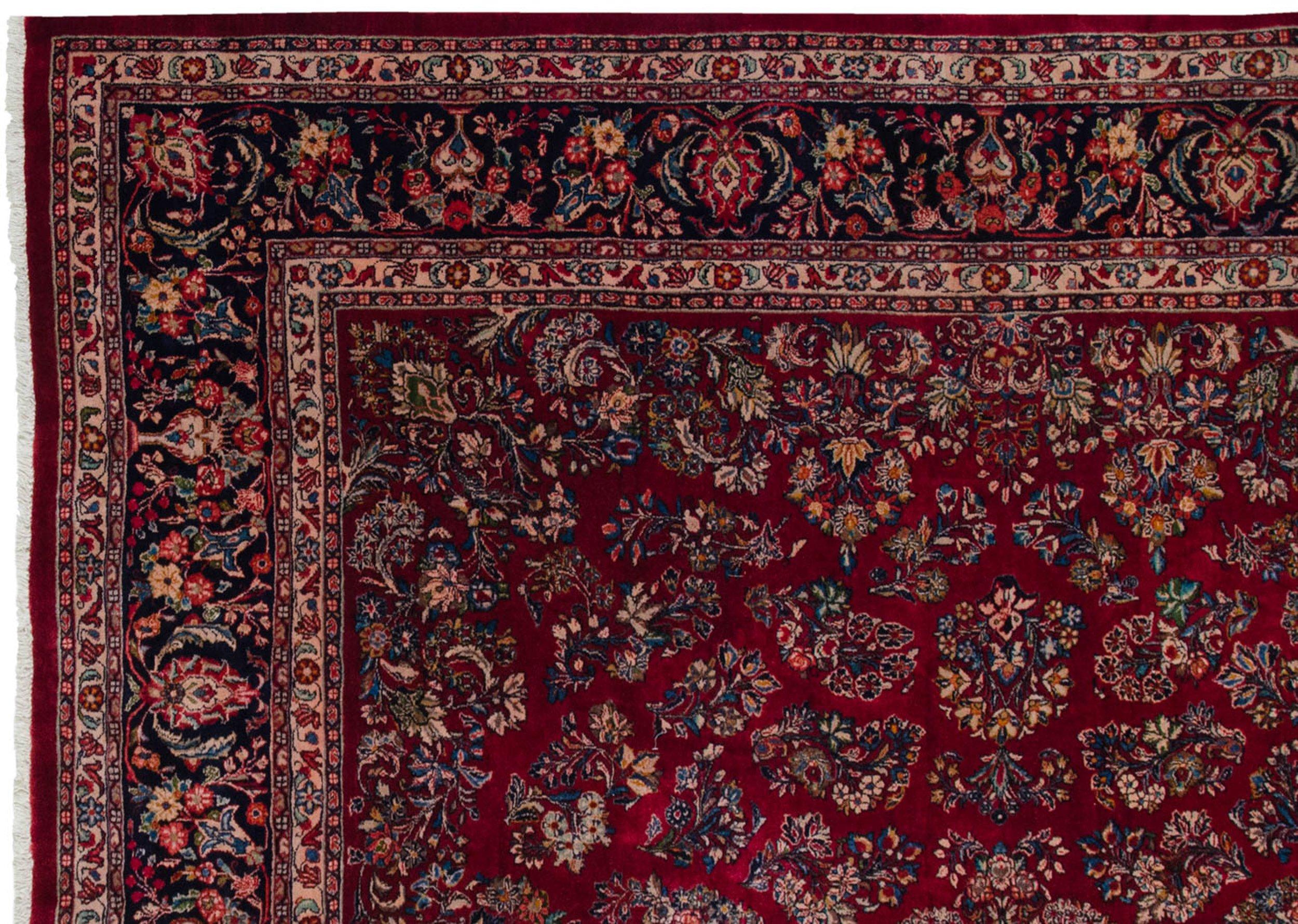:: Allover covered field in floral sprays and bouquets in a classic Sarouk motif from the early and mid 20th century. Phenomenal gem tone shades paired with emaculate condition and hard to find scale and proportions. Colors and shades include: Ruby