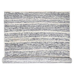 Tappeto oversize in lana annodata a mano 12
x14
9" nero e avorio con design a striature moderne