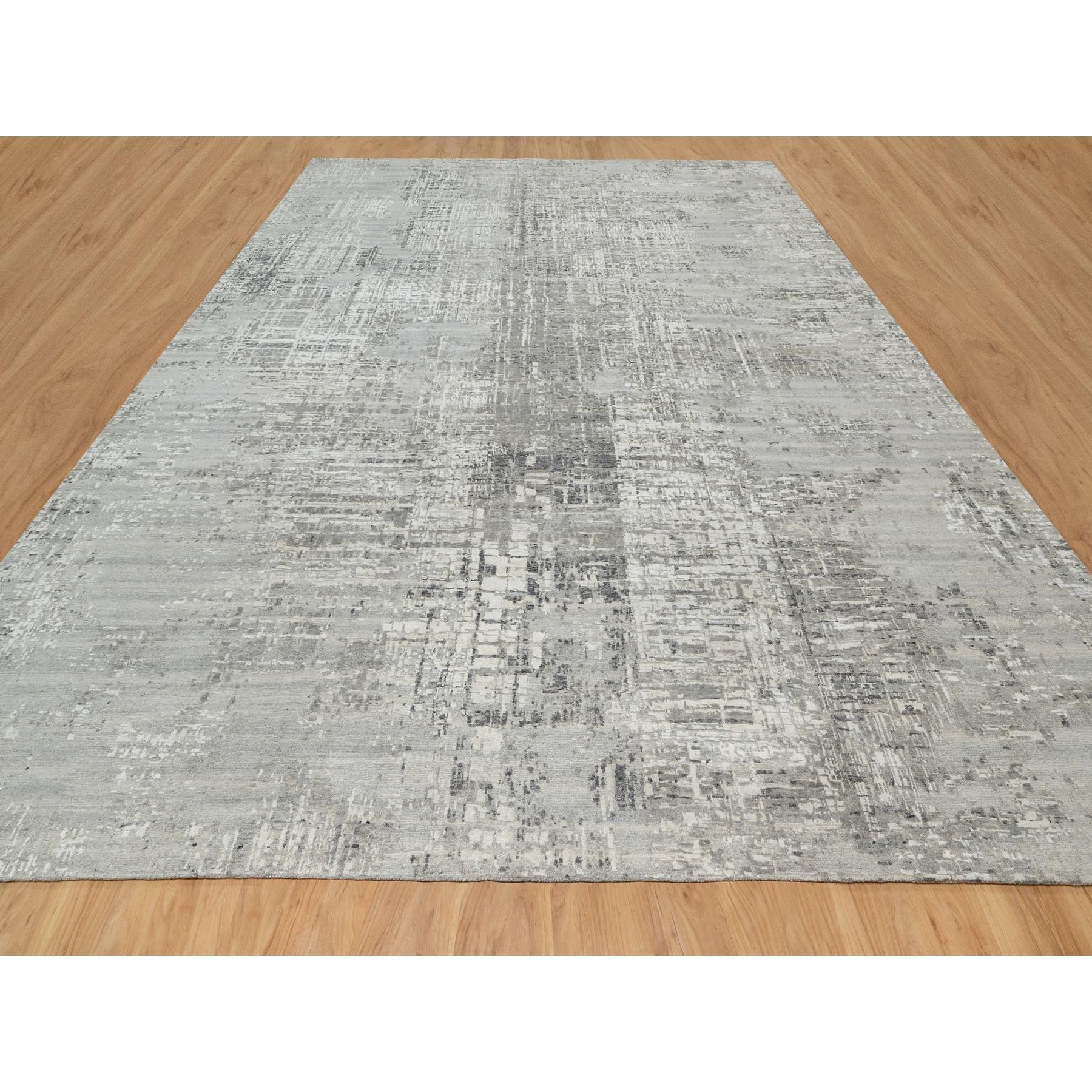 Sterling Gray, Hand Spun, Modern, Undyed Natural Wool, Hand Knotted, Oversized, Oriental Rug
Primary materials: Wool
Latex: No Pile 
height: 0.25 Inches
Style: Transitional
Primary color: Grey
Secondary colors: Ivory, Olive Black, Frost