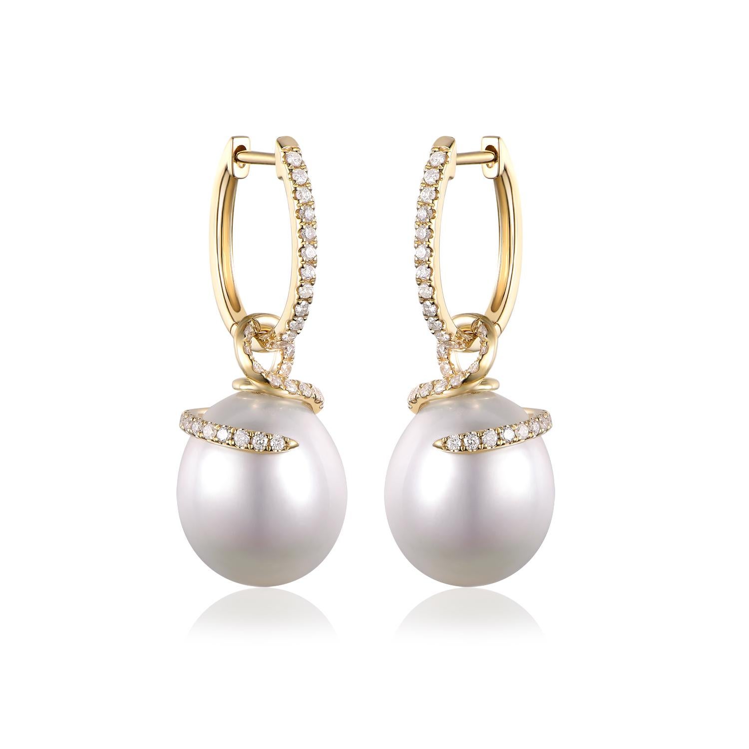 Discover the allure of these captivating drop earrings, featuring the organic charm of South Sea pearls. While they may not be perfectly round, the pearls' unique shape, measuring approximately 12 x 14mm, only adds to their natural splendor,