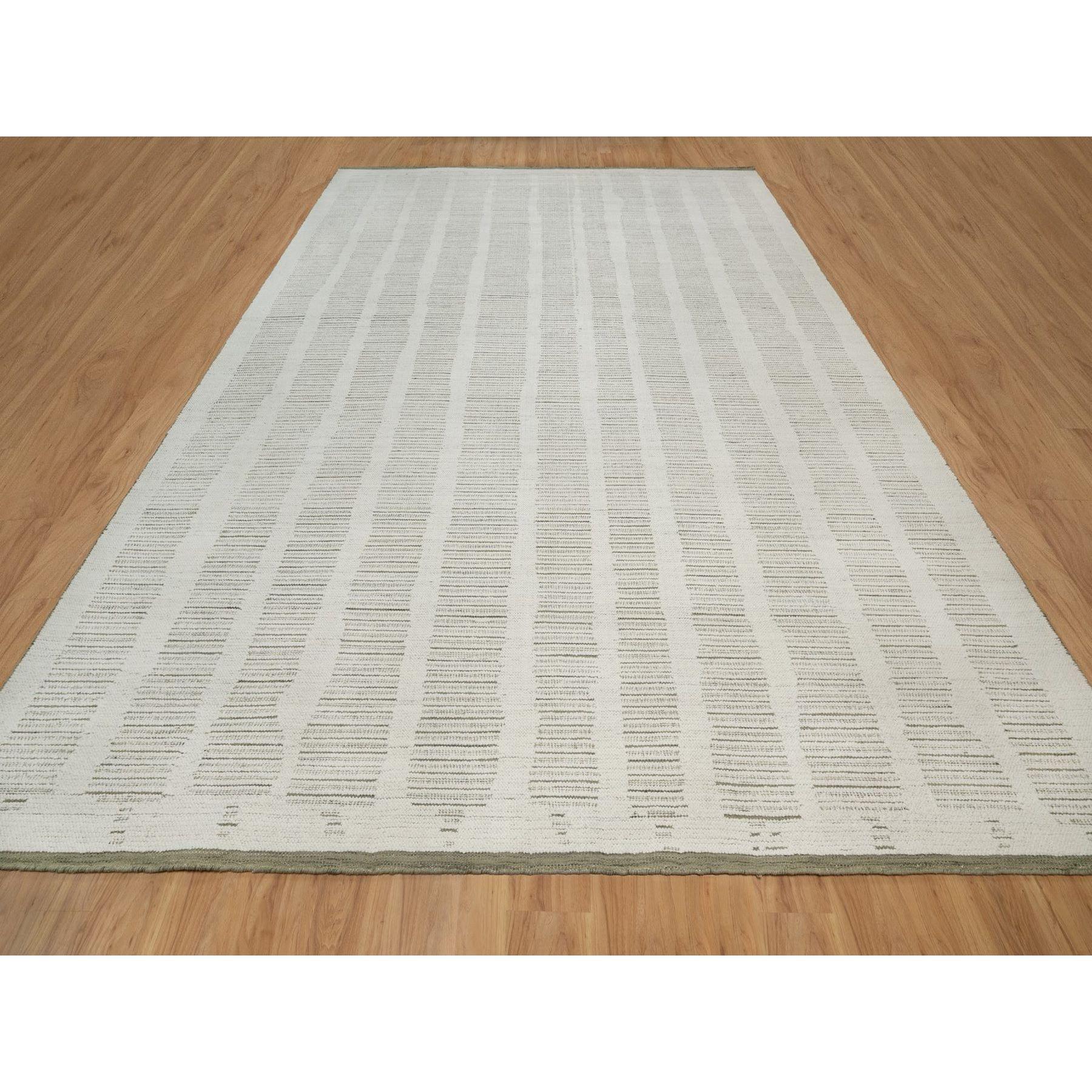 Alabaster White, Hand Woven, Flat Weave with Textured Pile, Undyed Natural Wool, XL, Oversized, Oriental Rug
Primary materials: Wool
Latex: No Pile 
height: 0.25 Inches
Style: Contemporary
Primary color: Ivory
Secondary colors: Green
Pattern: