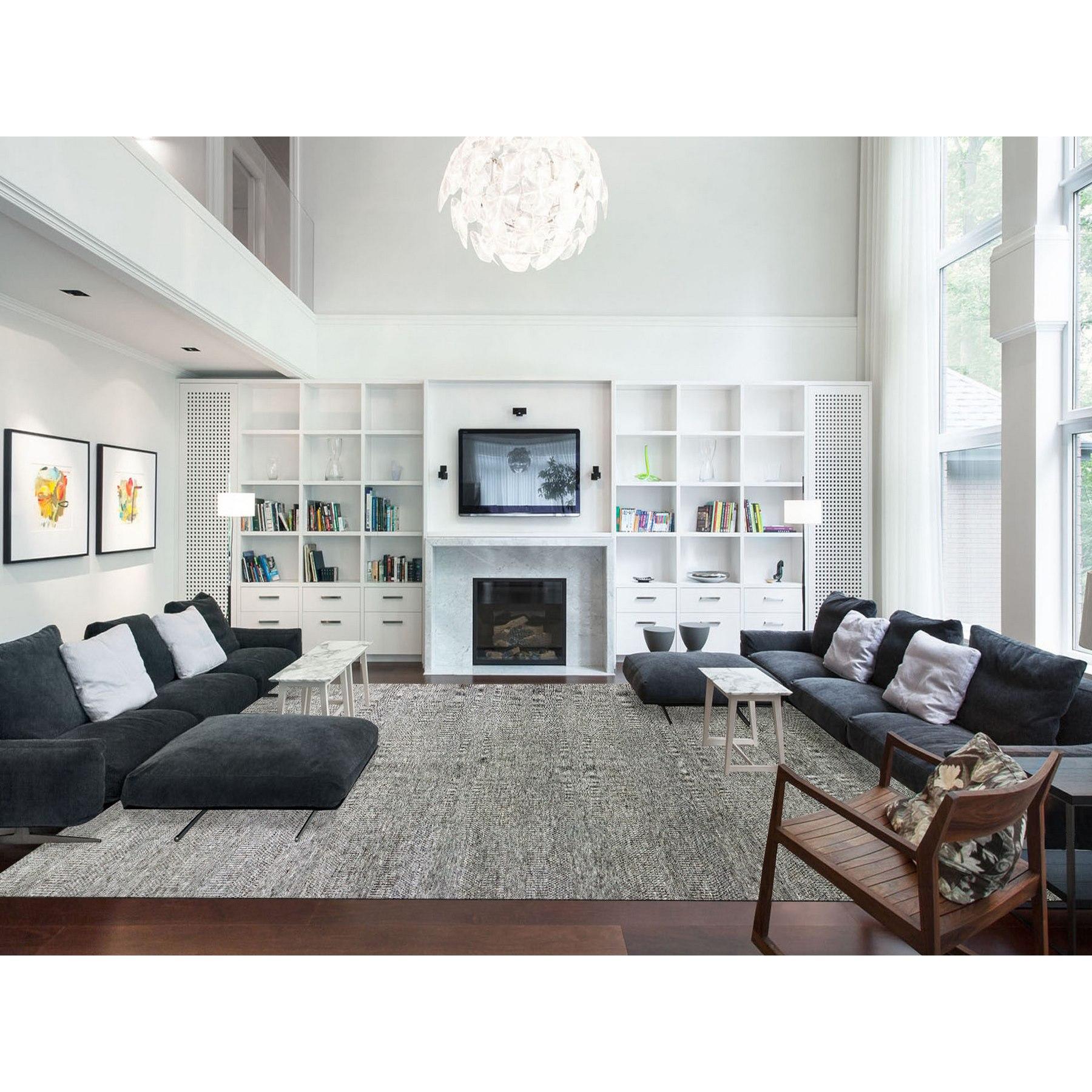 Medium Gray, Hand Knotted, Modern Grass Design, Natural Undyed Wool, Oversized Oriental Rug
Primary materials: Wool
Latex: No Pile 
height: 0.25 Inches
Style: Transitional
Primary color: Grey
Secondary colors: Black, Light Gray, Ivory
Pattern: