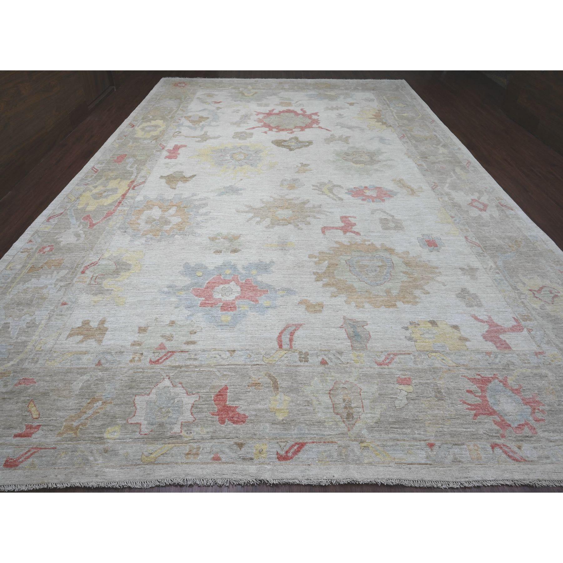 Cotton White, Afghan Angora Oushak with Large Leaf Design, Hand Knotted, Vegetable Dyes, 100% Wool, Oversized, Oriental Rug
Primary materials: Wool
Latex: No Pile 
height: 0.25 Inches
Style: Transitional
Primary color: Ivory
Secondary colors: Red,