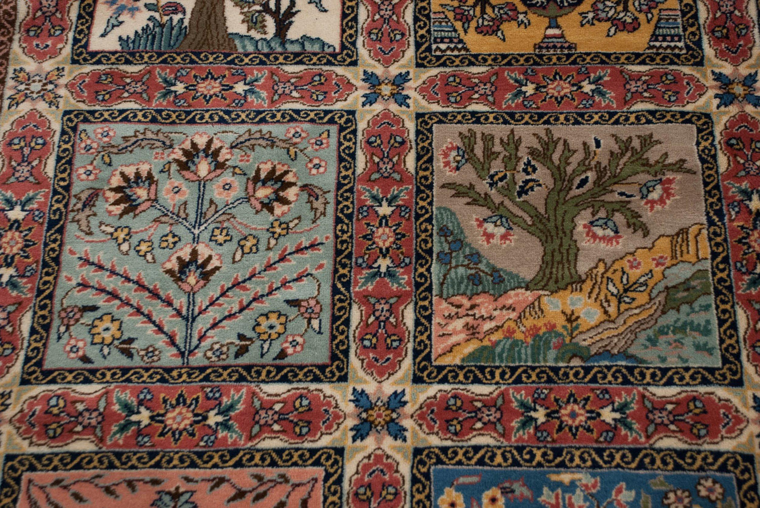 Gardens of paradise design motif with roundel pomegrante stylized center medallion within main channels of blossomed buds and germinating plants, surrounded by paneled design motifs in Four Season imagery, bearing tree of life, willow trees, cypress