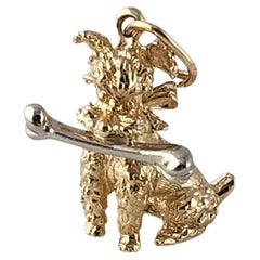 13 - 14K Yellow Gold Poodle Dog With a White Gold Bone Pendant #23855