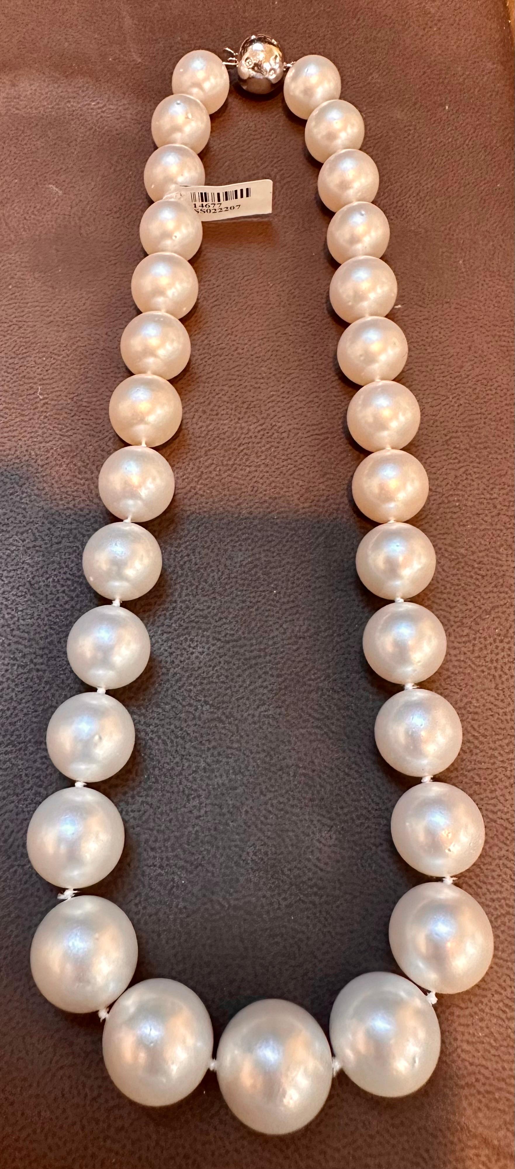  Introducing our exquisite 13-16.5mm White South Sea Round Pearl Necklace - AAA Quality. This stunning piece features 29 impeccable pearls, each measuring between 13 and 16.5 millimeters in diameter. The pearls exhibit a flawless round shape with a