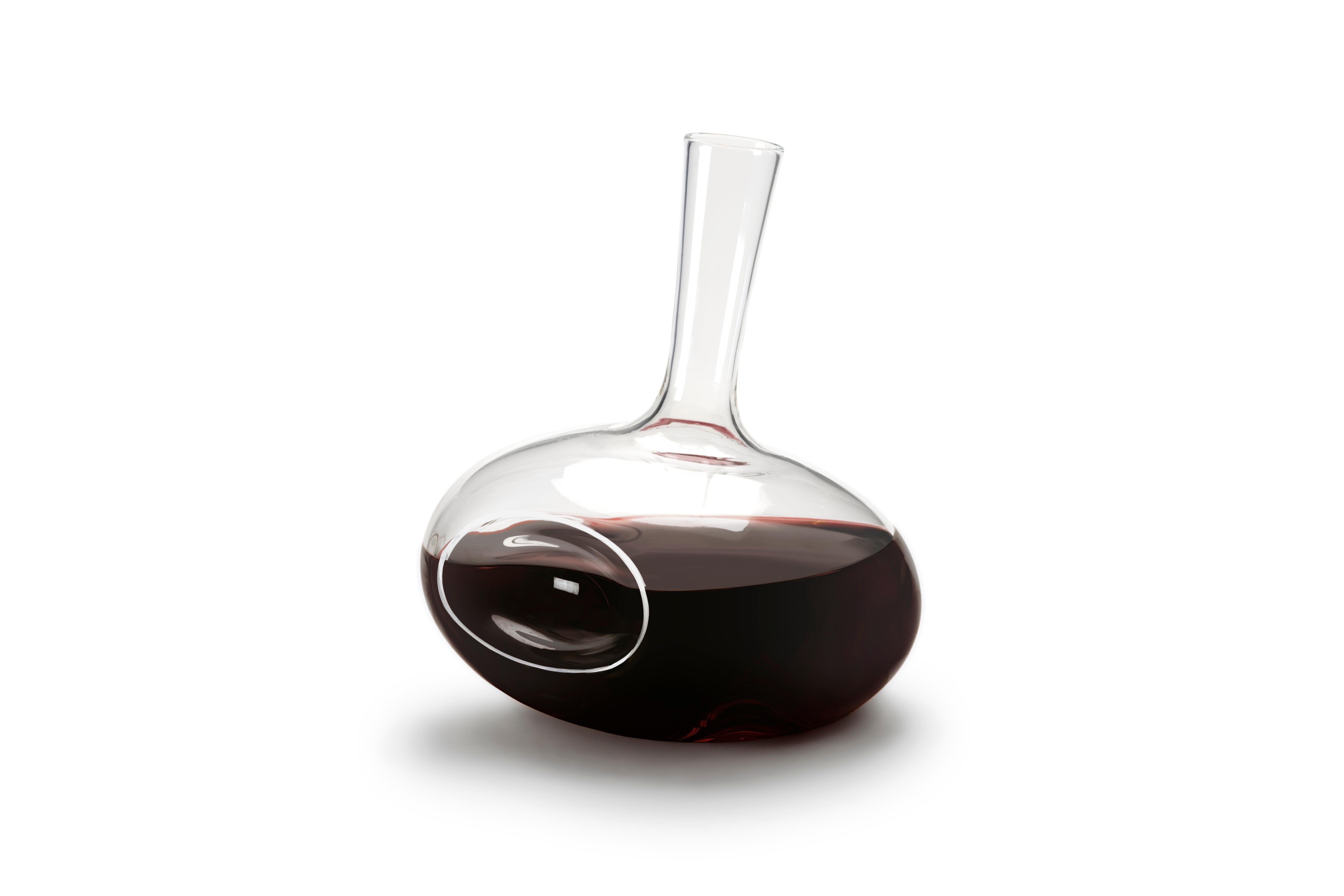 13˚ 60˚ 104˚
Borosilicate.
25 cm in height and 21 cm in diameter.
Winner of a RedDot Design Award.
Open edition.

Mouth-blown and manually produced in Slovenia without the use of moulds. Decanters are made in 20-piece batches, no more frequently