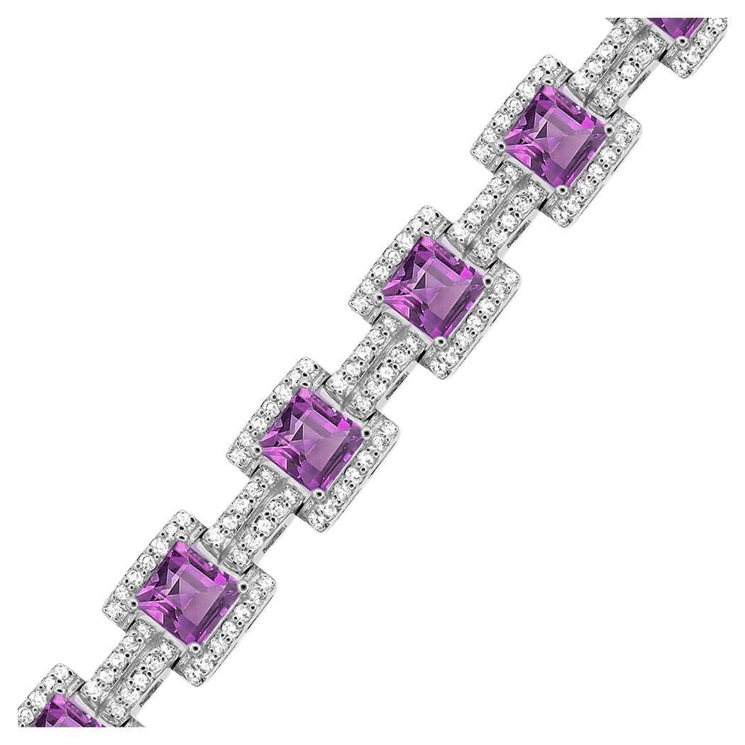 This exquisite piece showcases 12 square-cut amethysts, adorned with shimmering 288 white round topaz accents, exuding a timeless beauty. Crafted with precision and set in genuine sterling silver. Elevate your style and embrace the allure of this