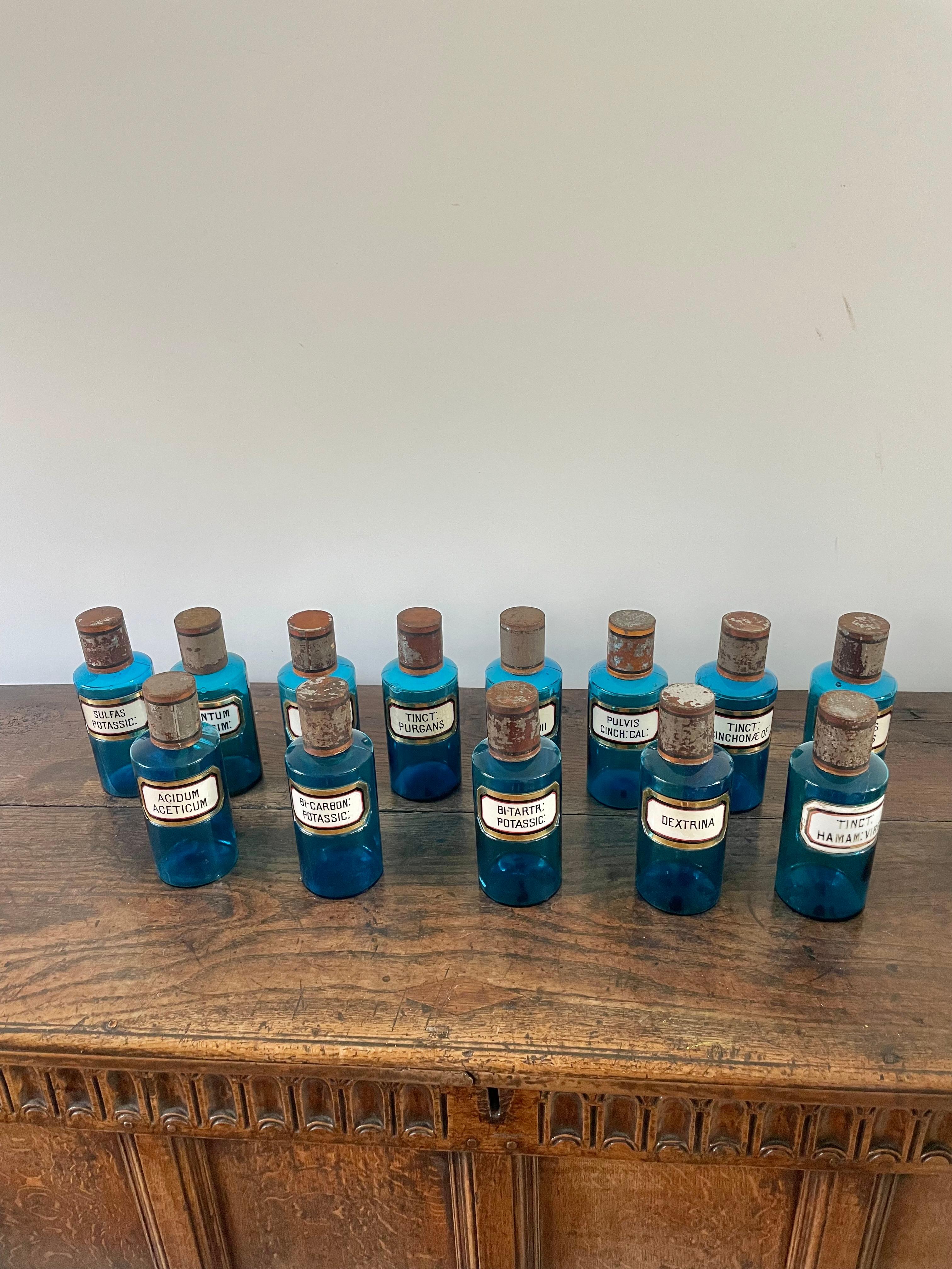 Good collection of 13 blue glass apothecary bottles 

French circa 1900 with original glass and enamel labels 

Paris maker , ground pontil mark 

Height 8.5 inches 

Diameter 3.5 