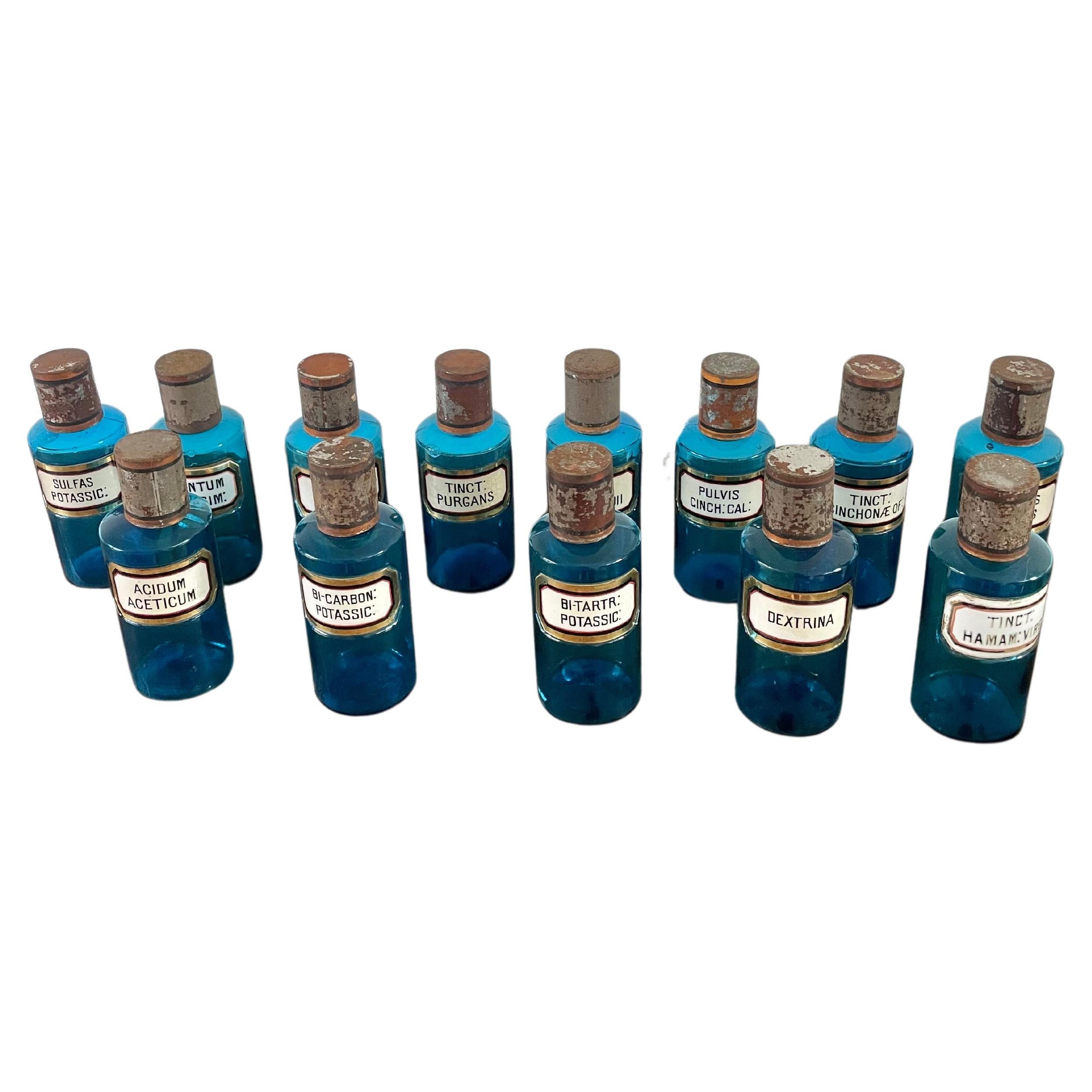 13 antiche bottiglie da farmacia in vetro blu