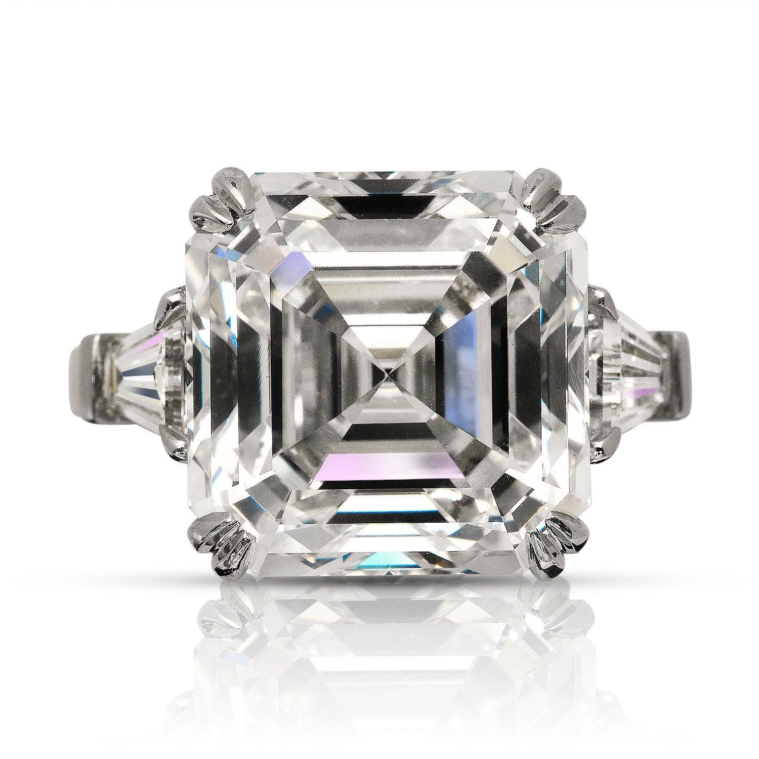 ATHENA -13 CARAT ASSCHER CUT DIAMOND ENGAGEMENT RING  BY MIKE NEKTA
GIA CERTIFIED
Center Diamond:

Carat Weight: 11.9 Carats
Color : G*
Clarity: VVS2
Style: ASSCHER CUT 
Approximate Measurements: 12.4 x 12.3 x 8.6 mm
* This diamond has been treated