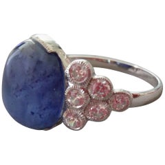 Antique 13 Carat Blue Sapphire Oval Cabochon Gold Full Cut Round Diamonds Cocktail Ring