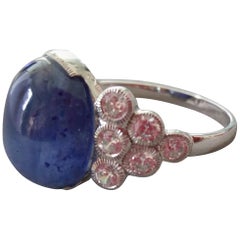 Used 13 Carat Blue Sapphire Oval Cabochon Gold Full Cut Round Diamonds Cocktail Ring