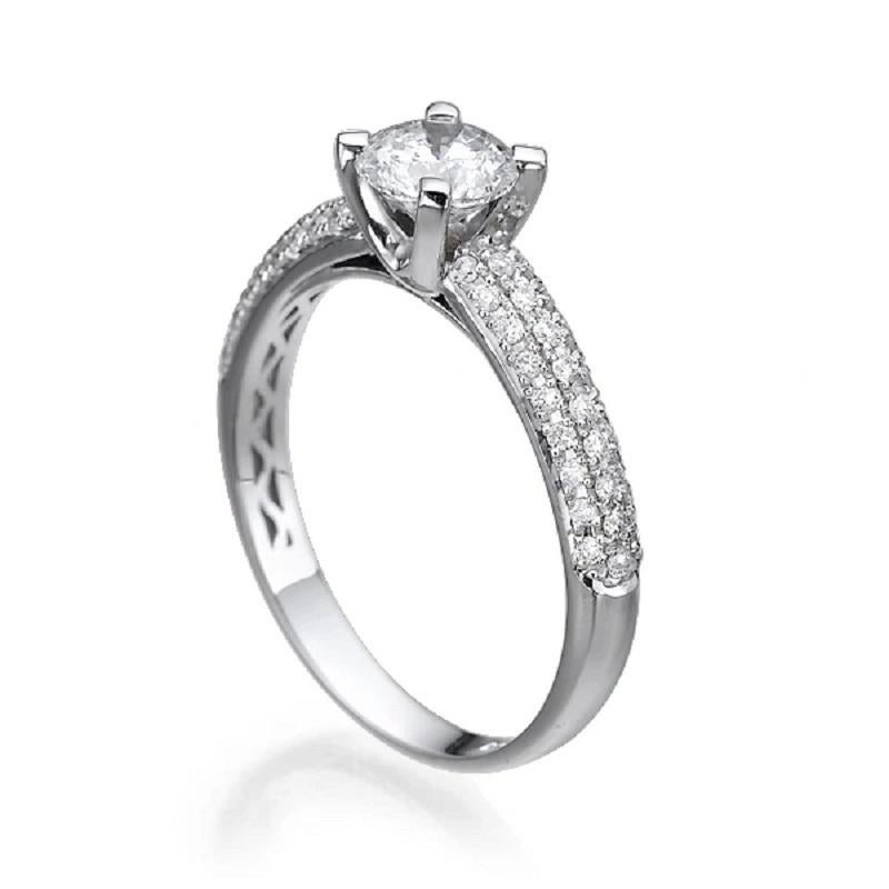 Beautiful solitaire with accents 3-row micro pave diamond engagement ring. Center stone is of 1 carat, natural, round shape, F-G color, VS2-SI1 clarity diamond and it is surrounded with 54 natural, round diamonds. Diamond is clarity enhanced.
 
