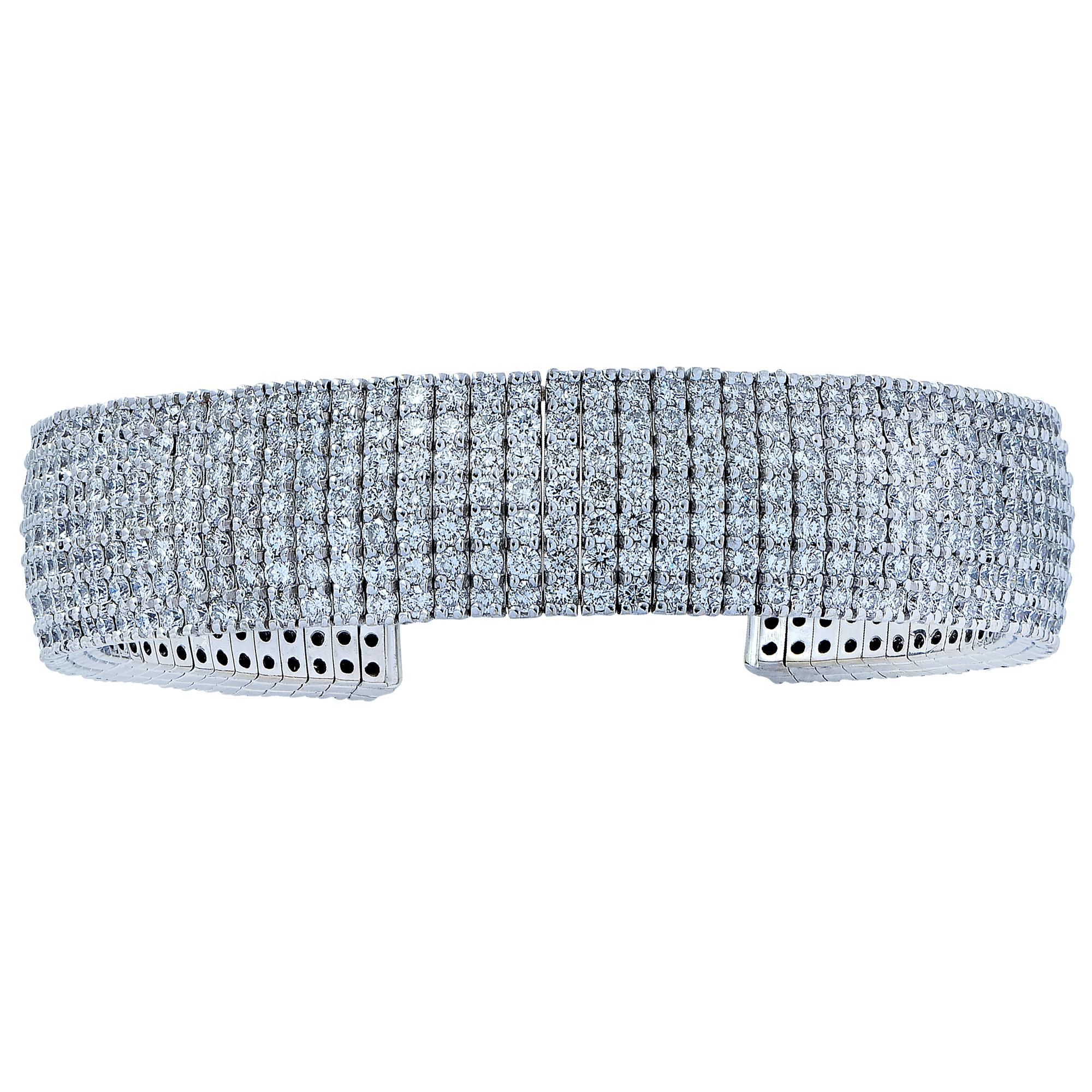 Spectacular diamond cuff bracelet finely crafted in 18 karat white gold featuring 560 round brilliant cut diamonds weighing approximately 13 carats, G-H color, VS clarity. Make an elegant statement with seven rows of dazzling diamonds wrapped around