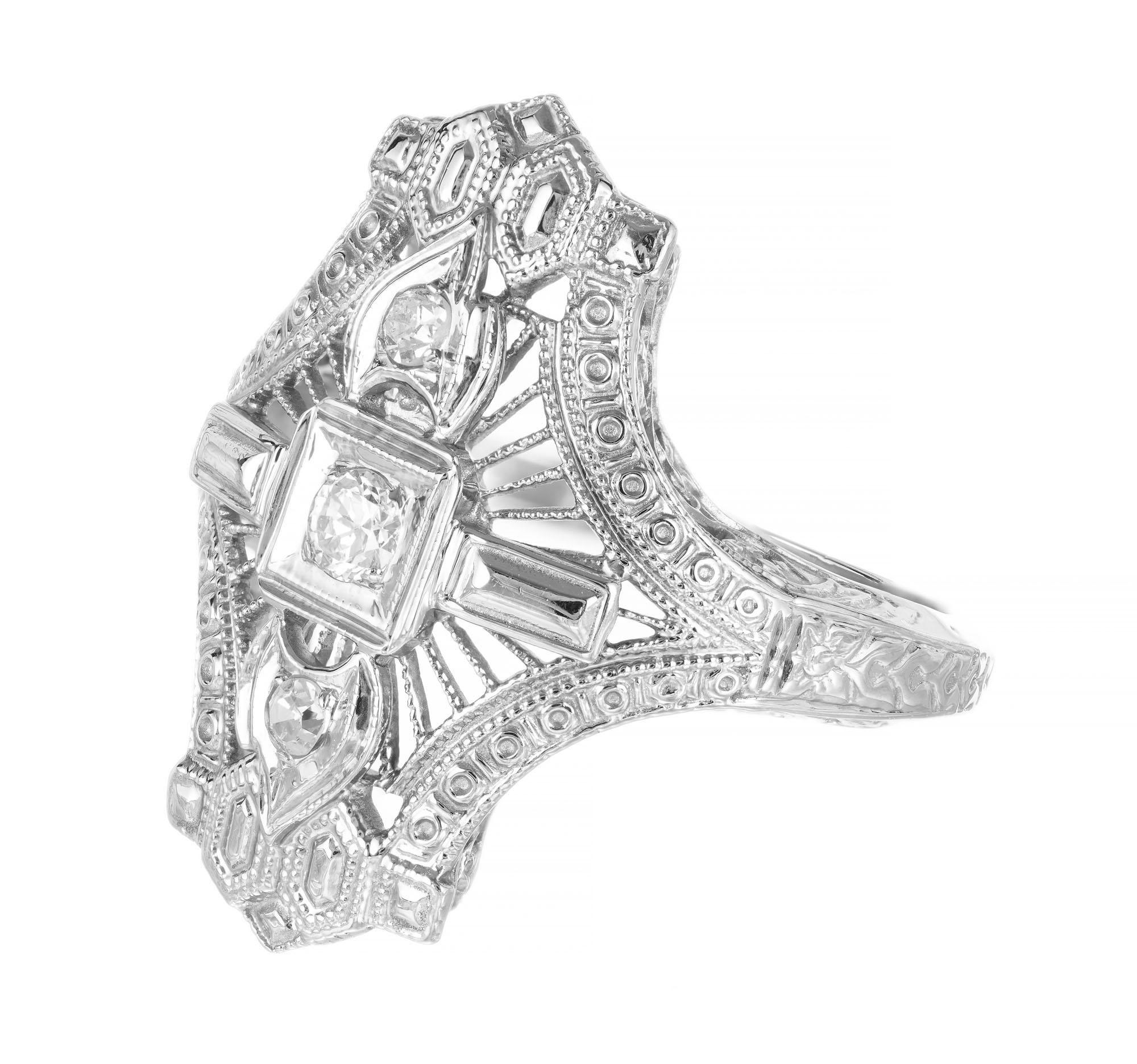 1930's 18k white gold open work diamond ring. European cut center stone with 2 single cut accent diamonds.  

1 old European cut diamond, G-H VS approx. .8cts
2 single cut diamond, H-I approx. .5cts
Size 4 and sizable
18k white gold 
Stamped: