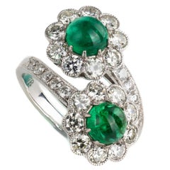 1.3 Carat Emerald and Diamonds 18 Karat White Gold Cross-over Ring