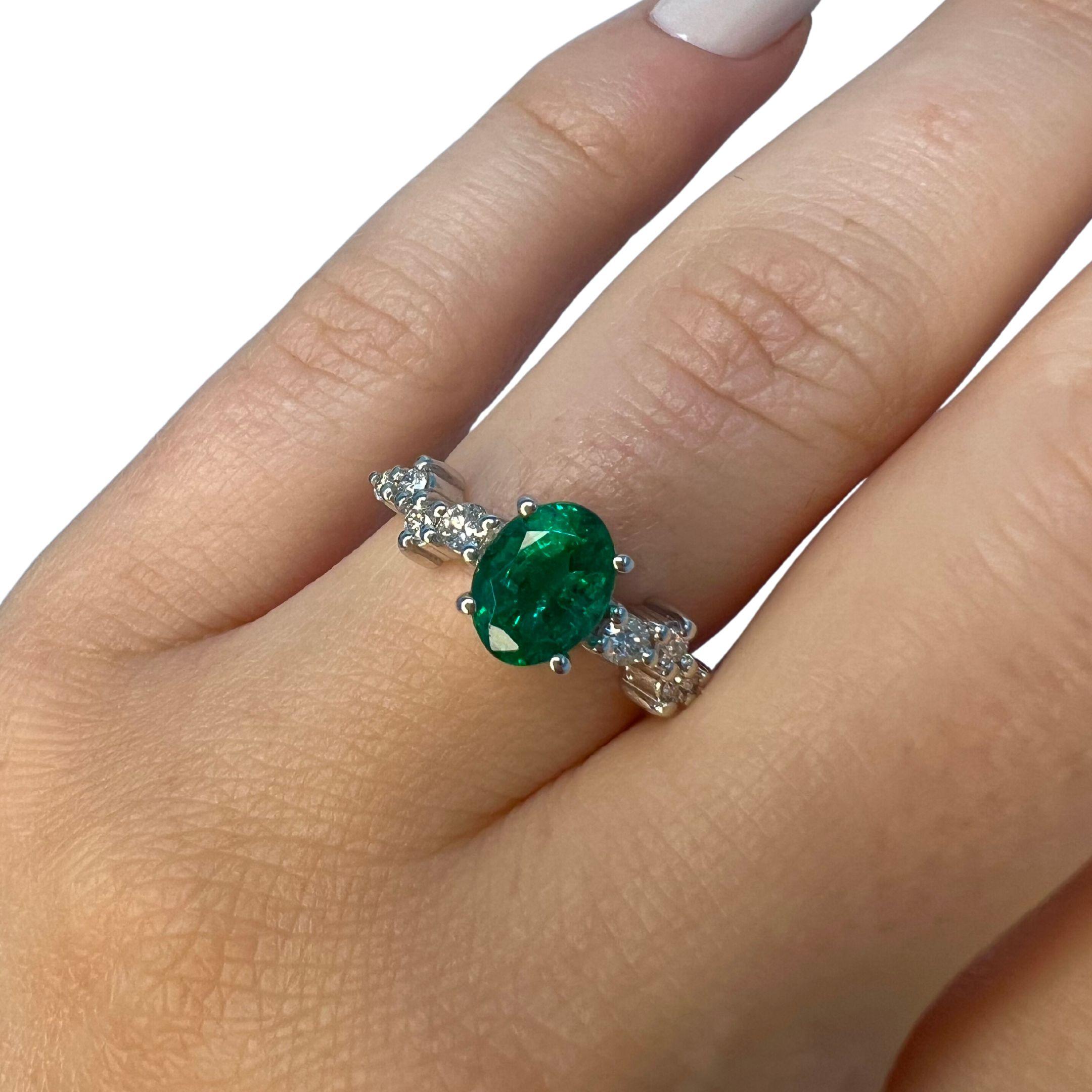 Emerald Weight: 1.31 CTs
Measurements: 8x6 mm
Diamond Weight: 0.20 CTs
Metal: 18K White Gold 
Gold Weight: 3.41 gm
Ring Size: 6.5
Shape: Oval
Color: Intense Green
Hardness: 7.5-8
Birthstone: May
Product ID: MUR25318/Line 14