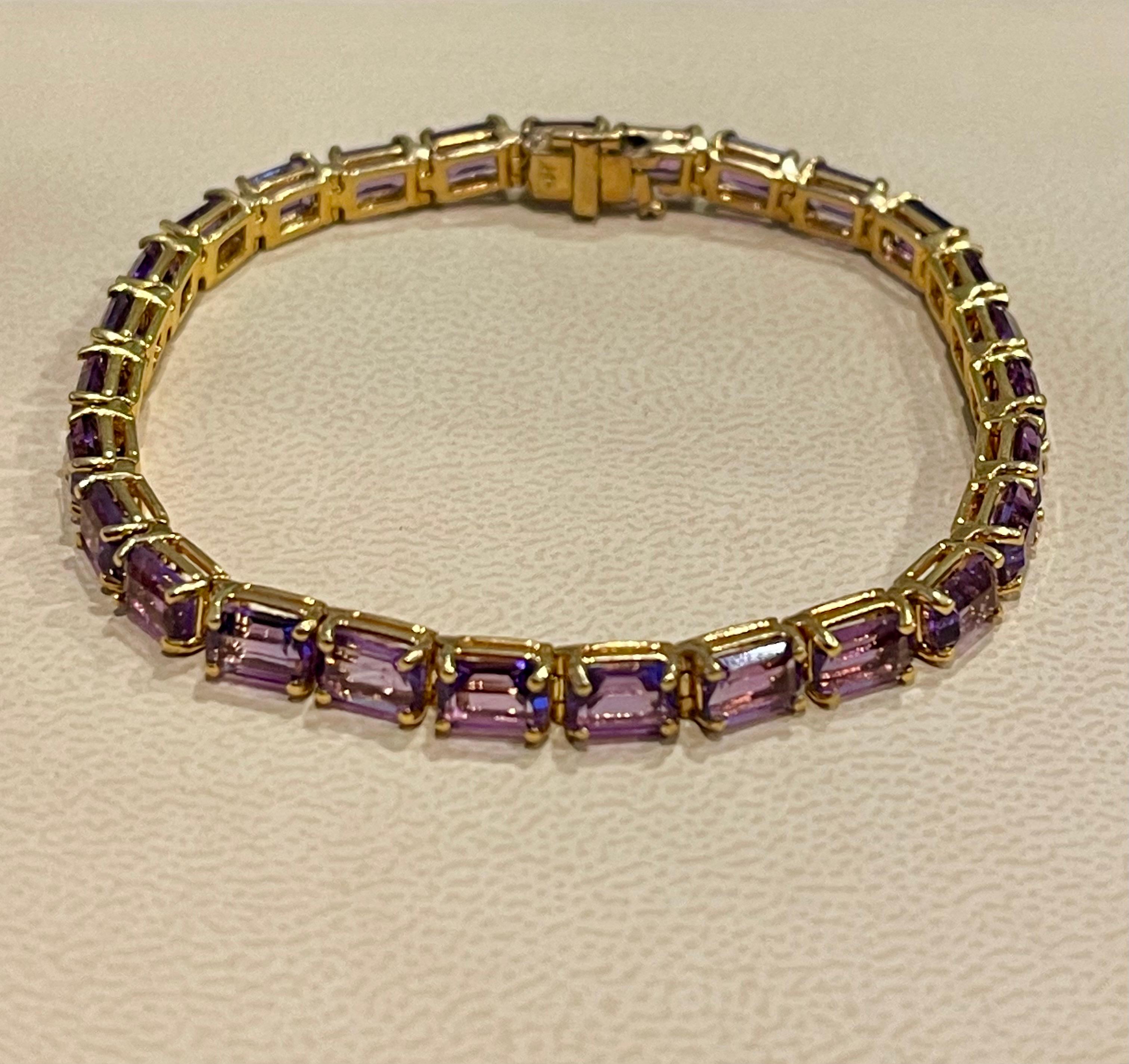  This exceptionally affordable Tennis  bracelet has  27 stones of Emerald cut  Amethyst
Beautiful colors , very Vibrant
Size of the stone is approximately 6X4 mm

Total weight of these Amethysr  is approximately 1 Ct
The bracelet is expertly crafted
