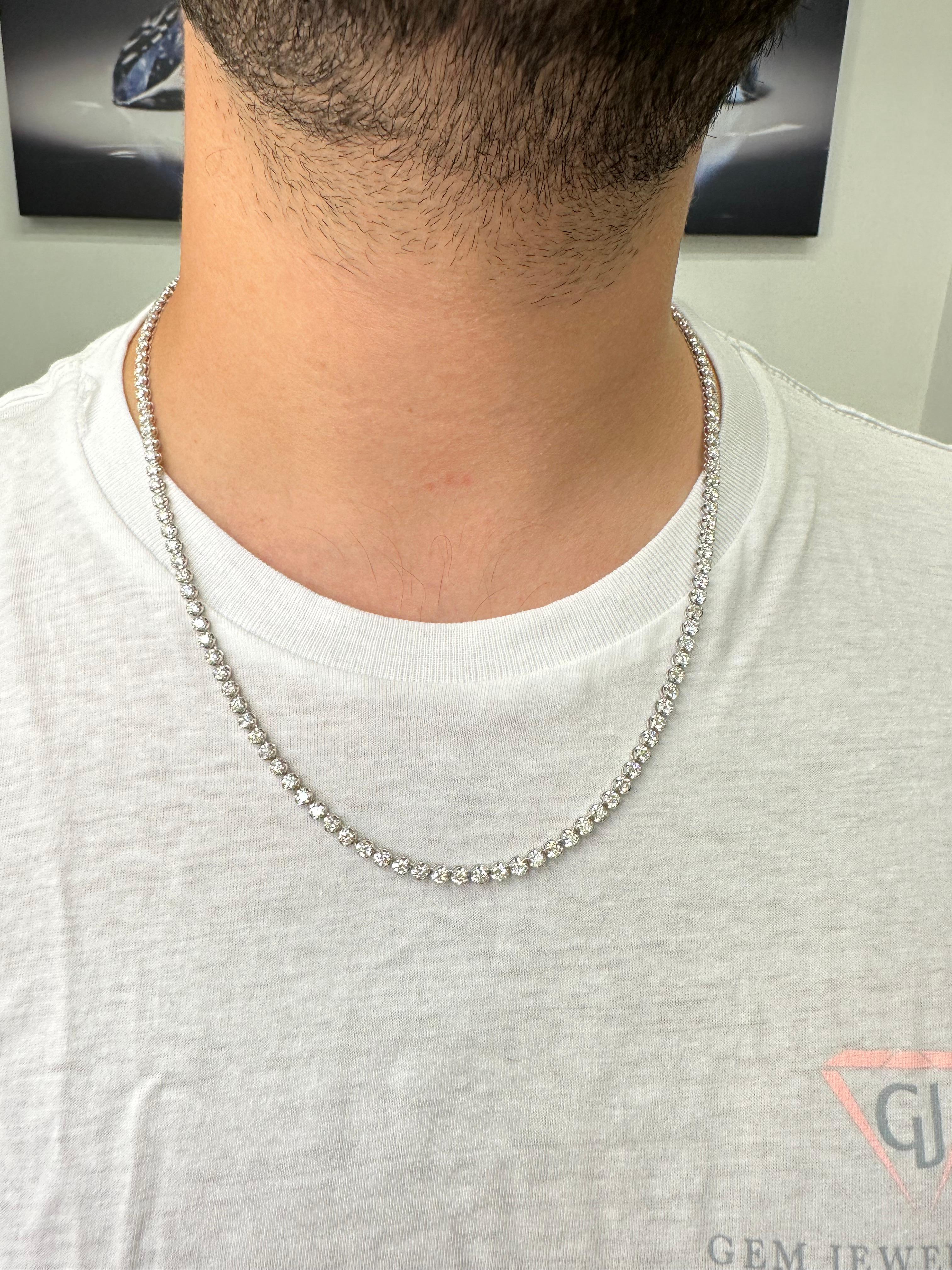 The 13 Carat Men's Diamond Tennis Necklace Chain is a true statement piece. This tennis necklace is crafted from 14K White Gold, which provides a classic and elegant look. At the heart of this tennis necklace are the 13 carats of Diamonds set in a